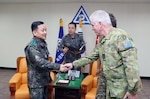 In this file photo, Gen. Soon Jin Lee, commander of Republic of Korea Army 2nd Operational Command, greets Australian Army Group Capt. Ralph Kettle, deputy director of Multi-National Coordination Center (MNCC), during an office call at the 2OC Headquarters in Daegu as part of the annual Key Resolve Exercise. This exercise includes multi-national forces that contribute to readiness as United Nations Command “Sending States”. The Sending States are comprised of the 16 nations that provided combat, combat support, or combat service support during the Korean War and were present during the signing of the Armistice Agreement. Their contributions are coordinated through the MNCC.    