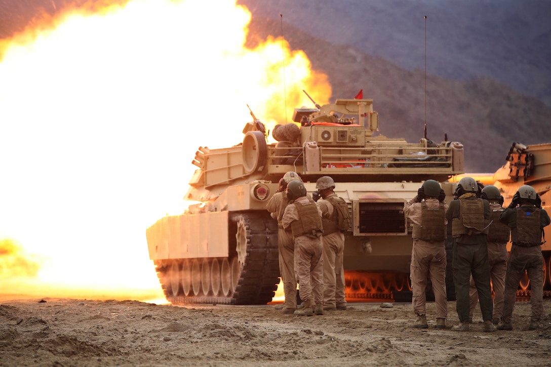 Marines with Tank Platoon, Company B, Ground Combat Element Integrated Task Force, send rounds down range via lanyard fire at Range 500, Marine Corps Air Ground Combat Center Twentynine Palms, California, March 1, 2015. From October 2014 to July 2015, the GCEITF will conduct individual and collective level skills training in designated ground combat arms occupational specialties in order to facilitate the standards-based assessment of the physical performance of Marines in a simulated operating environment performing specific ground combat arms tasks. (U.S. Marine Corps photo by Cpl. Paul S. Martinez/Released) 