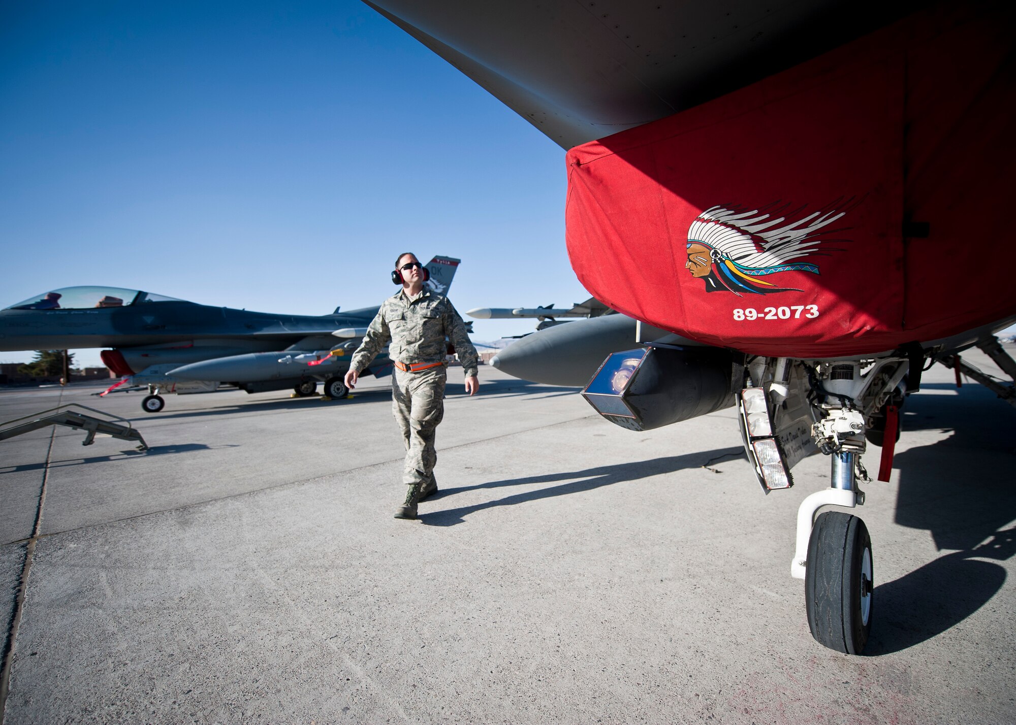 Staff Sgt. Derek Rogers, crew chief assigned to the 125th Aircraft Maintenance Squadron, Tulsa Air National Guard Base, Okla., inspects an F-16 Fighting Falcon during Red Flag 15-2 at Nellis Air Force Base, Nev., March 6, 2015. Crew chiefs are responsible for overseeing the day-to-day maintenance of aircraft, including diagnosing malfunctions and replacing components, and conducting various inspections to ensure the aircraft is functioning properly. (U.S. Air Force photo by Staff Sgt. Siuta B. Ika)