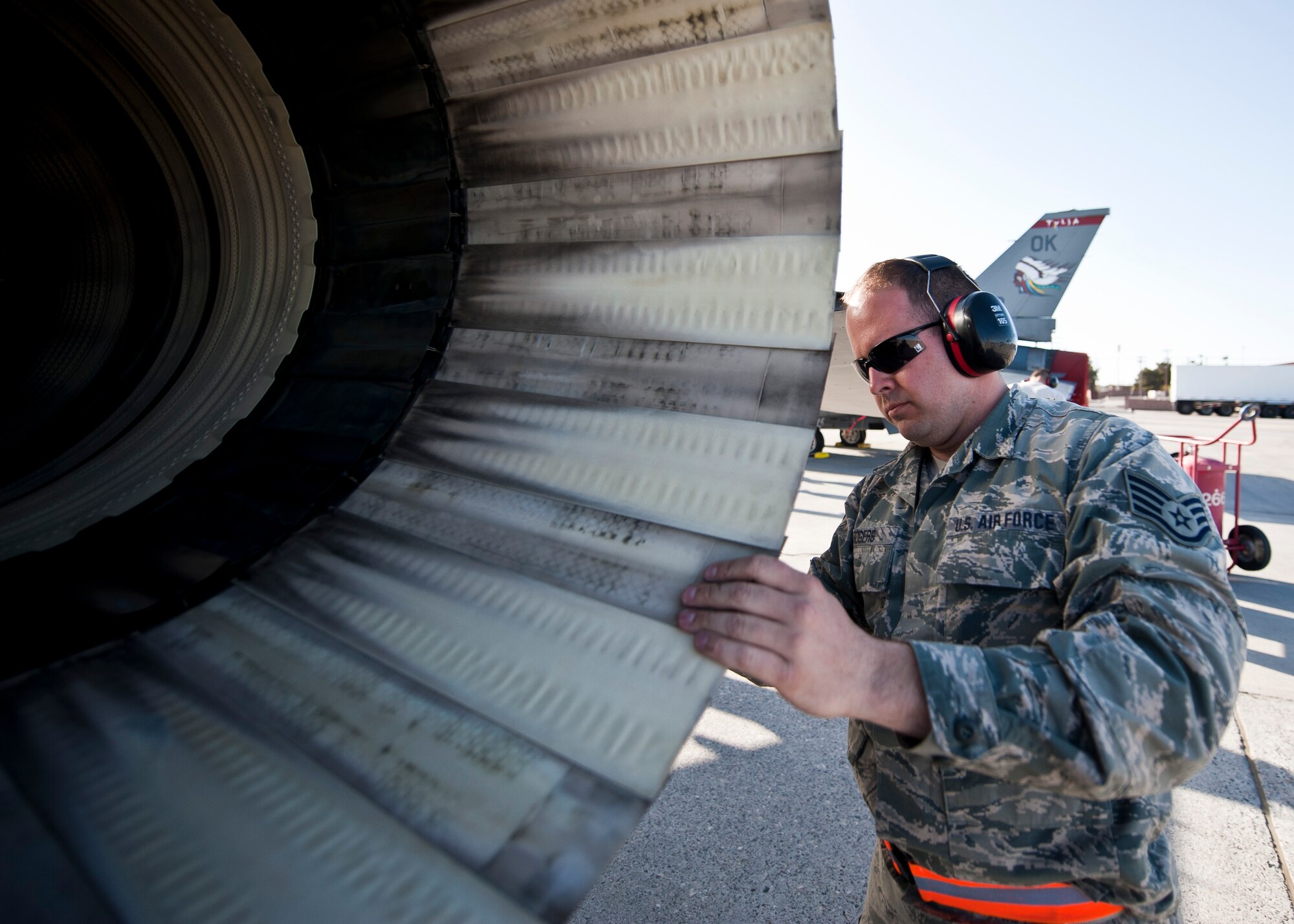 Staff Sgt. Derek Rogers, crew chief assigned to the 125th Aircraft Maintenance Squadron, Tulsa Air National Guard Base, Okla., inspects an F-16 Fighting Falcon during Red Flag 15-2 at Nellis Air Force Base, Nev., March 6, 2015. Red Flag exercises provide a series of intense scenarios for aircrew and ground personnel to increase their combat readiness and effectiveness for future real-world missions. (U.S. Air Force photo by Staff Sgt. Siuta B. Ika)