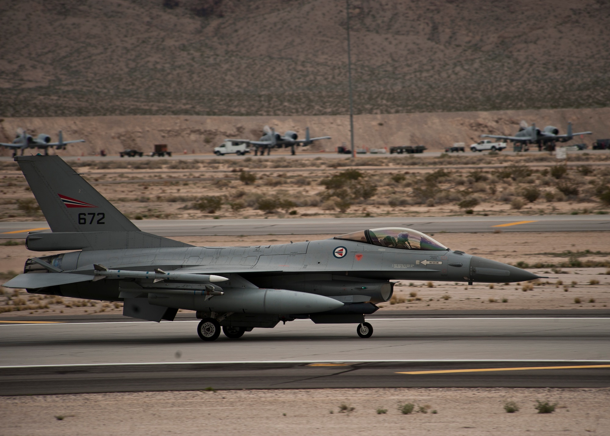 A Royal Norwegian Air Force F-16 Fighting Falcon taxis after a Red Flag 15-2 sortie at Nellis Air Force Base, Nev., March 11, 2015. Flying units from around the world come to Nellis AFB to participate in Red Flag exercises, which are held three to four times per year. (U.S. Air Force photo by Staff Sgt. Siuta B. Ika)