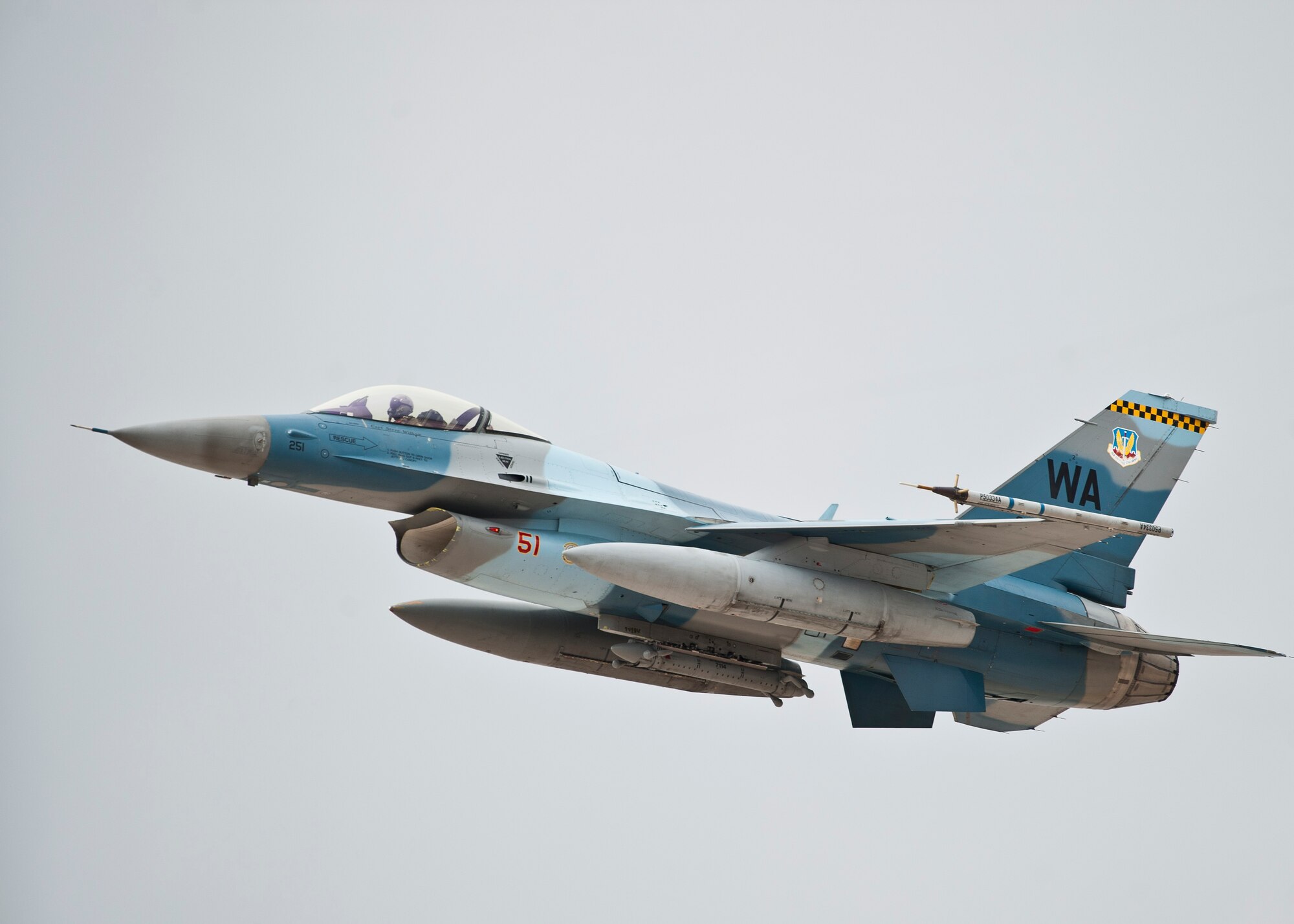 An F-16 Fighting Falcon assigned to the 64th Aggressor Squadron makes a pass in preparation for landing after a Red Flag 15-2 sortie at Nellis Air Force Base, Nev., March 11, 2015. Red Flag is one of a series of advanced training programs administered by the U.S. Air Force Warfare Center designed to increase combat readiness and effectiveness. (U.S. Air Force photo by Staff Sgt. Siuta B. Ika)