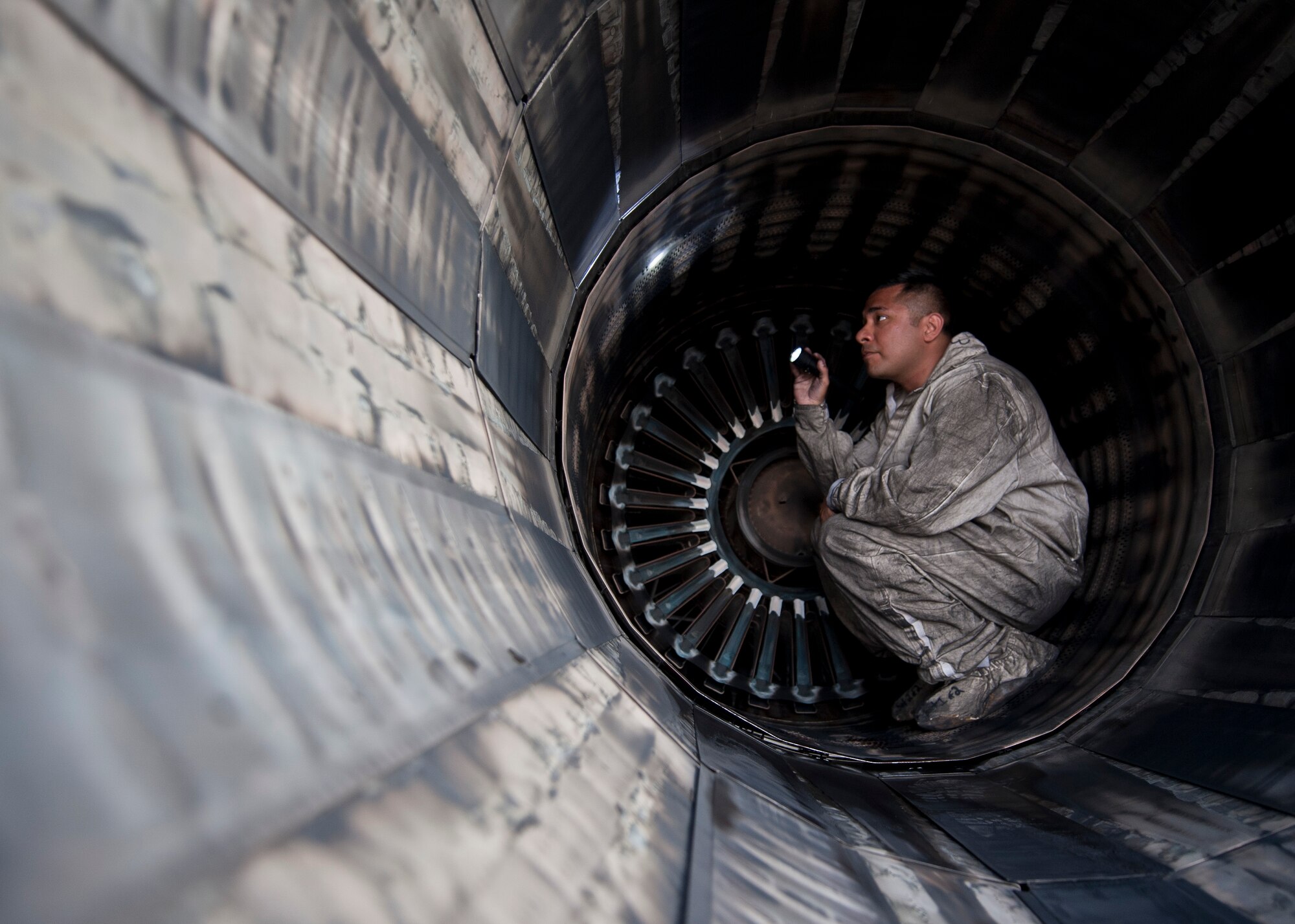 Staff Sgt. Esteban Ramirez, an aerospace propulsion technician assigned to the 28th Aircraft Maintenance Squadron, Ellsworth Air Force Base, S.D., inspects the exhaust of a B-1B Lancer during Red Flag 15-2 at Nellis AFB, Nev., March 10, 2015. Red Flag provides realistic combat training in a contested, degraded and operationally-limited environment, which provides aircrews with real-time war scenarios and helps ground crews test and improve their operational readiness. (U.S. Air Force photo by Staff Sgt. Siuta B. Ika)