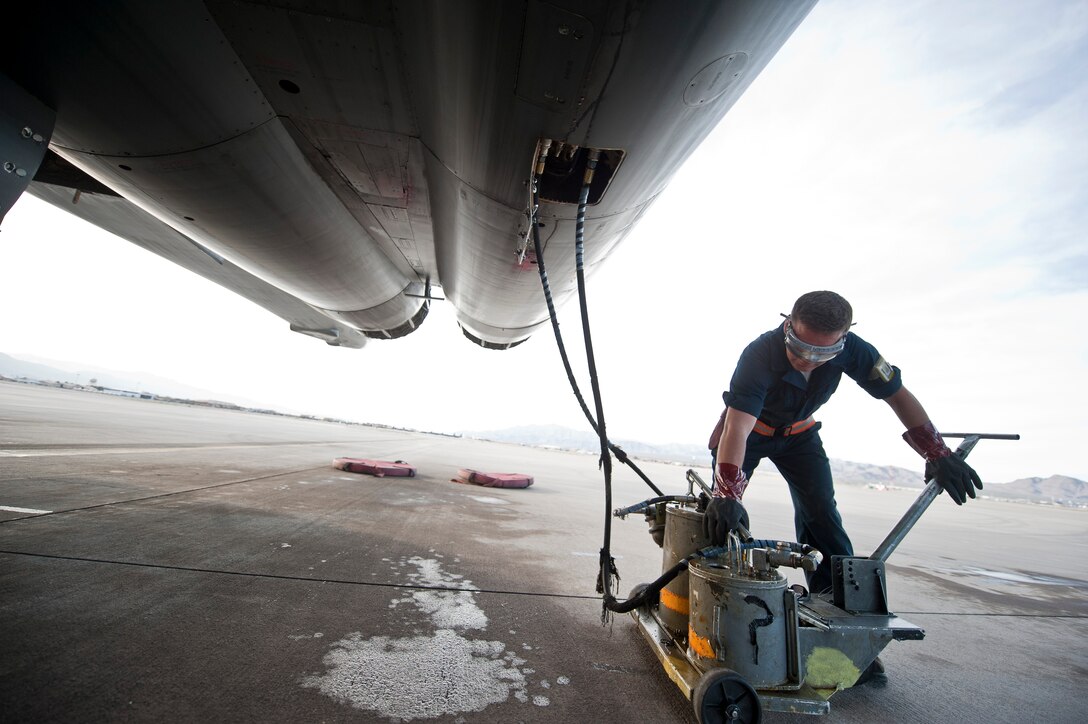 Senior Airman Brandon Wilkins, a crew chief assigned to the 28th Aircraft Maintenance Squadron, Ellsworth Air Force Base, S.D., services oil of a B-1B Lancer during Red Flag 15-2 at Nellis AFB, Nev., March 10, 2015. Crew chiefs are responsible for overseeing the day-to-day maintenance of aircraft, including diagnosing malfunctions and replacing components, and conducting various inspections to ensure the aircraft is functioning properly. (U.S. Air Force photo by Staff Sgt. Siuta B. Ika)