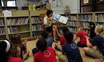 Dawn Ige, first lady of Hawaii, reads “The Three Questions” to a group of Hickam Elementary School students during the school’s annual Read Across America event at Joint Base Pearl Harbor-Hickam, Hawaii, March 10, 2015. The week-long event celebrates the life and contributions of Dr. Seuss, while also encouraging children and teens to read. (U.S. Air Force photo by Tech. Sgt. Terri Paden/RELEASED)