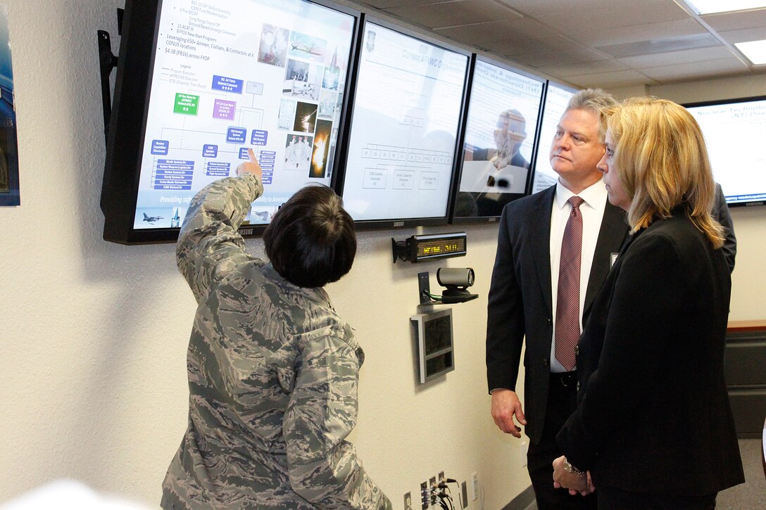 Maj. Gen. Sandra Finan, commander, Air Force Nuclear Weapons Center, discusses the preeminent center of nuclear excellence with Secretary of the Air Force Deborah Lee James, and Steve Amburgey, Deputy Program Executive Officer for Strategic Systems, March 9 at Kirtland Air Force Base, N.M.  Strategic Systems is scheduled to fully integrate with the AFNWC later this year. The proposed change will better align nuclear acquisition responsibility, authority, and accountability, creating more efficient life cycle support of nuclear systems by combining acquisition and product support.  (U.S. Air Force Photo by Meredith Mingledorff)