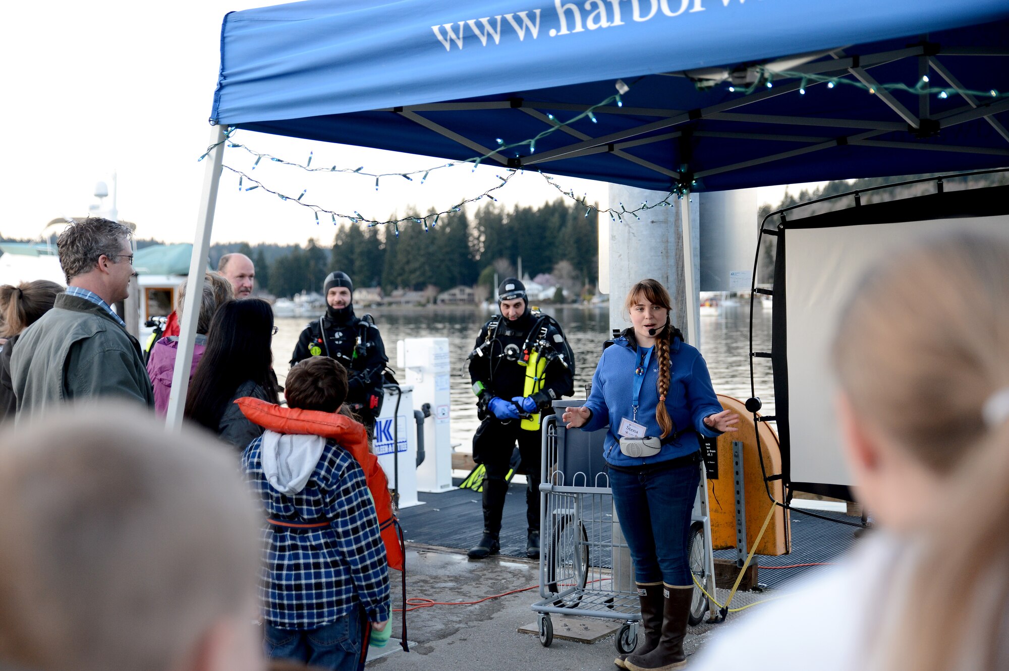 Stena Troyer, Harbor WildWatch science specialist, describes the event to the attendants March 7, 2015, during Pier into the Night at Gig Harbor, Wash. Pier into the Night is a monthly event that promotes environmental awareness and highlights marine wild life. (U.S. Air Force photo/Airman 1st Class Keoni Chavarria)