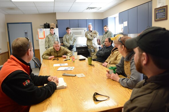 Senior Master Sgt. Ed Smith, 115th Fighter Wing Explosive Ordnance Disposal superintendent, briefs people from the Juneau County Forestry Department and the Department of Natural Resources prior to an EOD training exercise in Finley, Wis., March 6, 2015. The EOD team cleared a waterway for the Juneau County Forestry Department using various explosives. (U.S. Air National Guard photo by Senior Airman Andrea F. Rhode)