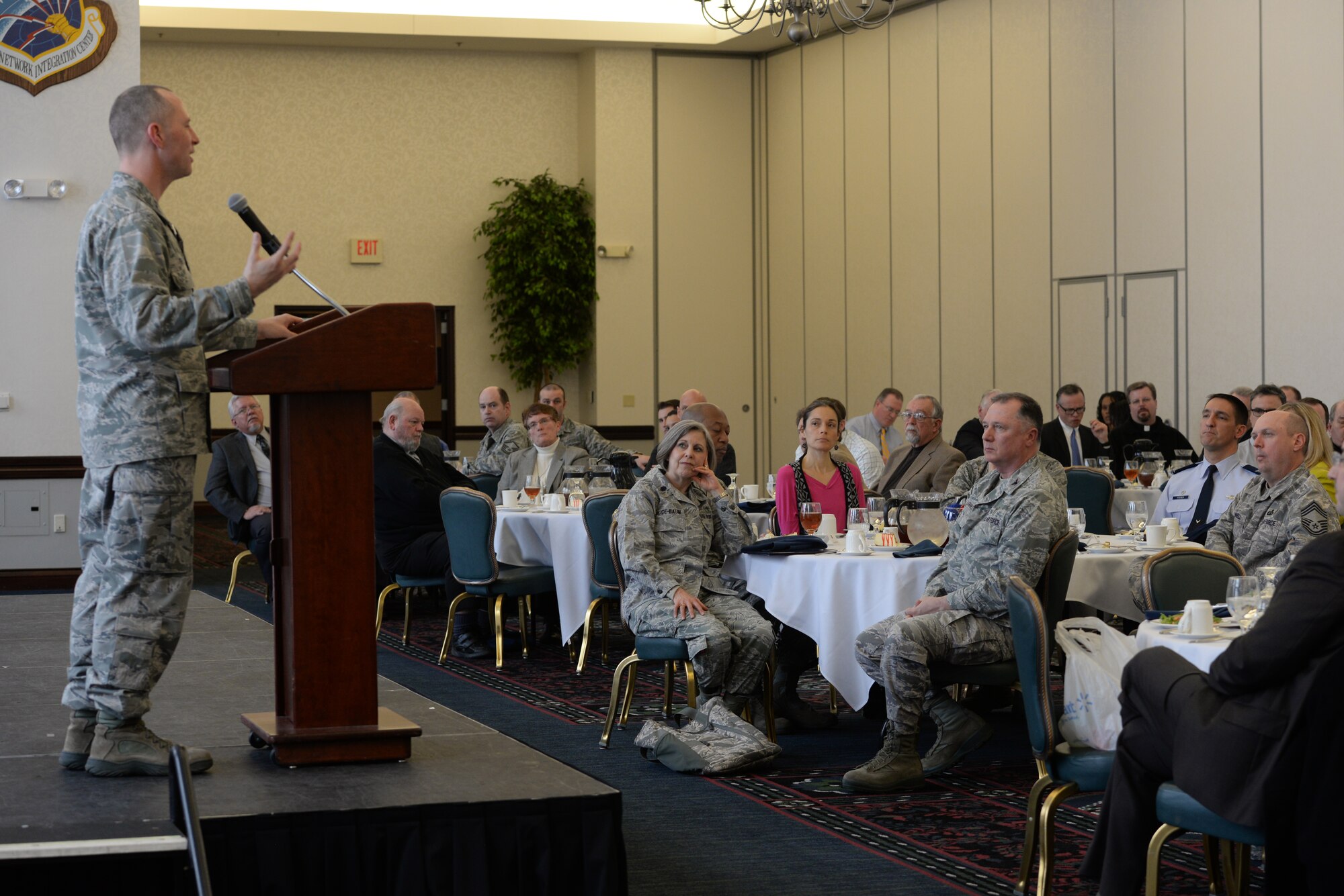 Maj. Erik Tisher, 375th Air Mobility Wing Chaplain, speaks to community faith leaders at the annual Faith Leadership Luncheon at Scott Air Force Base, Illinois on March 3, 2015. The goal of the luncheon is to reach out to community faith leaders and to teach them about the unique challenges facing military families. (U.S. Air Force photo by Senior Airman Sarah Hall-Kirchner)