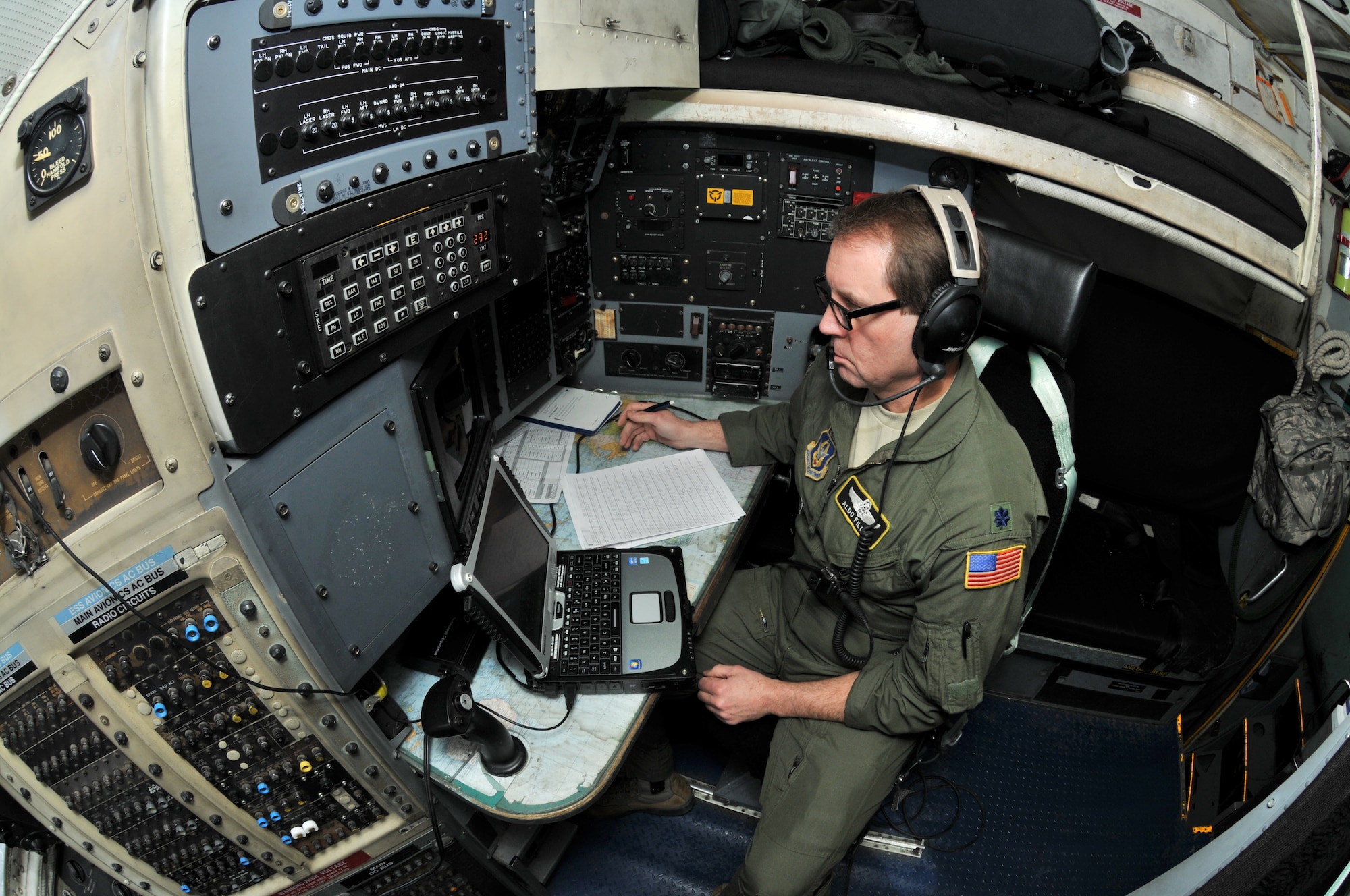 Lt. Col. Aldo Filoni, primary evaluator navigator with the 911th Operations Group, monitors the main aviation computer on a C-130 Hercules during an all-weather airdrop delivery system exercise sortie near Cadiz, Ohio, March 7, 2015. During an AWADS sortie, cargo is dropped from the aircraft in the middle of visibility reducing weather conditions. (U.S. Air Force photo by Senior Airman Marjorie A. Bowlden)
