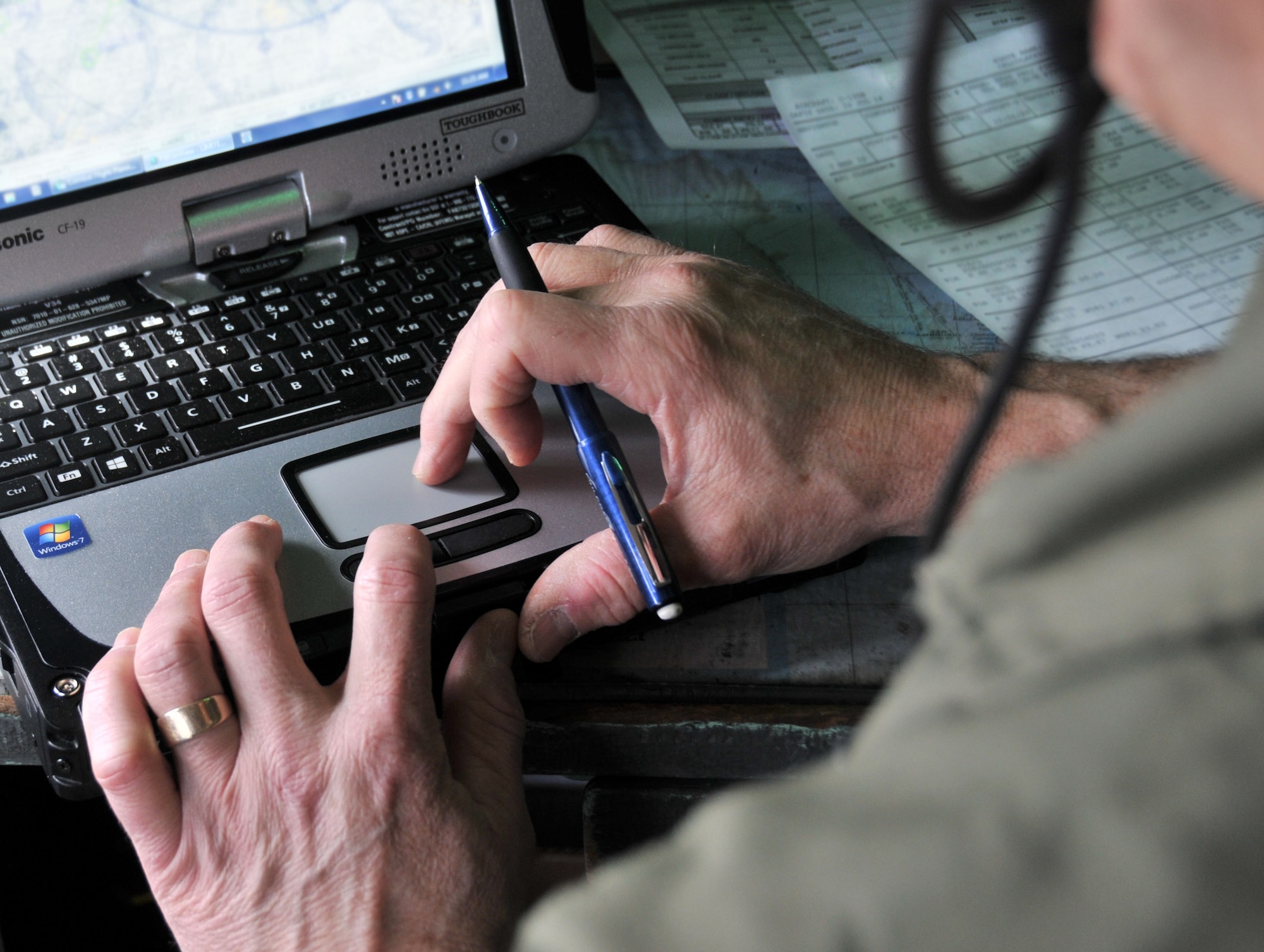 Lt. Col. Aldo Filoni, primary evaluator navigator with the 911th Operations Group, works with the navigation computer to plot course information into the main aviation computer of a C-130 Hercules prior to takeoff here, March 7, 2015. The navigator’s job is to plot the course into the main computer and communicate with the pilots to keep the plane on track. (U.S. Air Force photo by Senior Airman Marjorie A. Bowlden)