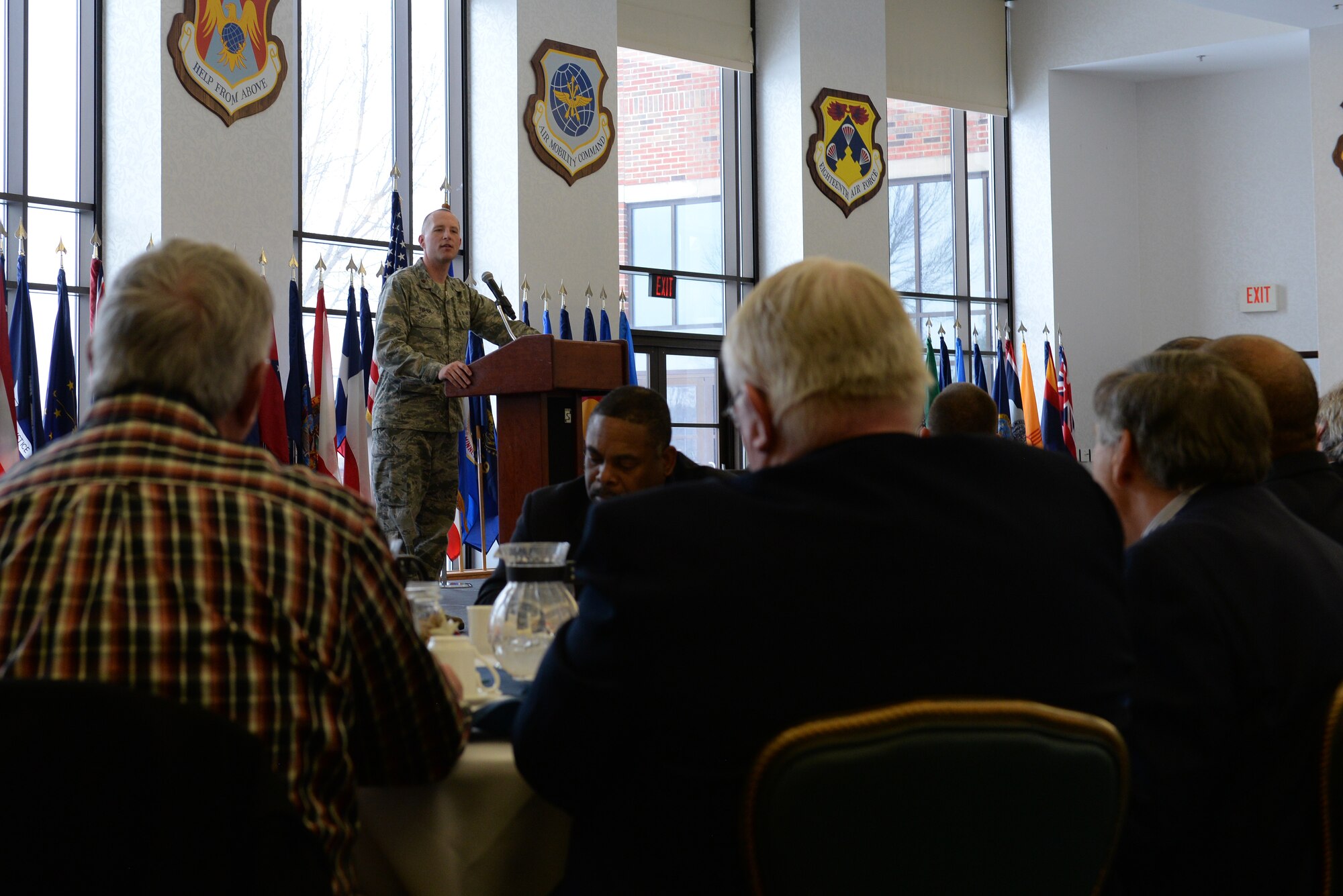Maj. Erik Tisher, 375th Air Mobility Wing Chaplain, speaks to community faith leaders at the annual Faith Leadership Luncheon at Scott Air Force Base, Illinois on March 3, 2015. The goal of the luncheon is to reach out to community faith leaders and to teach them about the unique challenges facing military families. (U.S. Air Force photo by Senior Airman Sarah Hall-Kirchner)