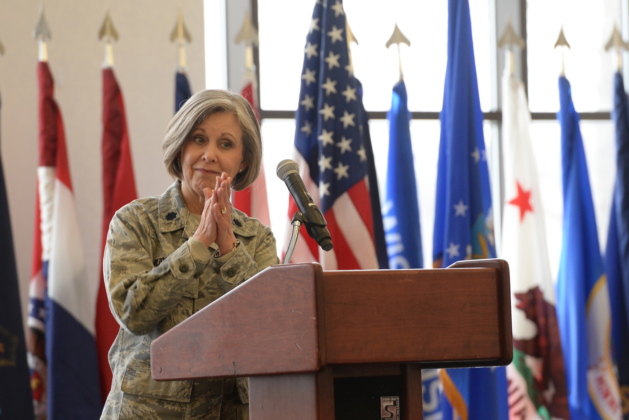 Lt. Col. Christine Blice-Baum, 375th Air Mobility Wing Chaplain, greets the crowd during the annual Faith Leadership Luncheon at Scott Air Force Base, Illinois on March 3, 2015. Community Faith Leaders were invited to Scott to learn about meeting the specific needs of military families. (U.S. Air Force photo by Senior Airman Sarah Hall-Kirchner)
