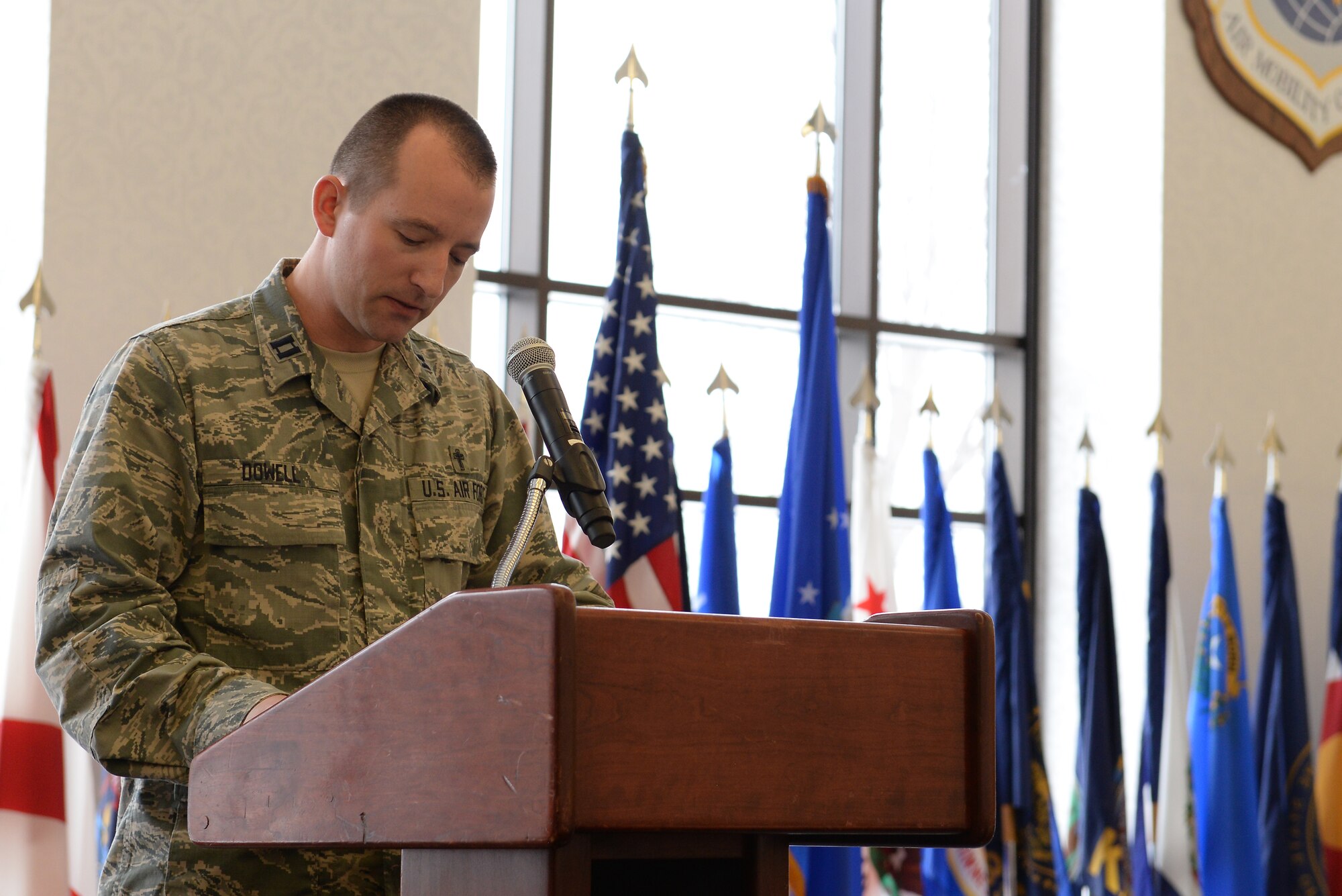 Capt. Eli Dowell, 375th Air Mobility Wing Chaplain, addresses the crowd at the annual Faith Leadership Luncheon at Scott Air Force Base, Illinois on March 3, 20015. The purpose of the luncheon is to teach community Faith Leaders about the unique challenges faced by military families. (U.S. Air Force photo by Senior Airman Sarah Hall-Kirchner/Released)