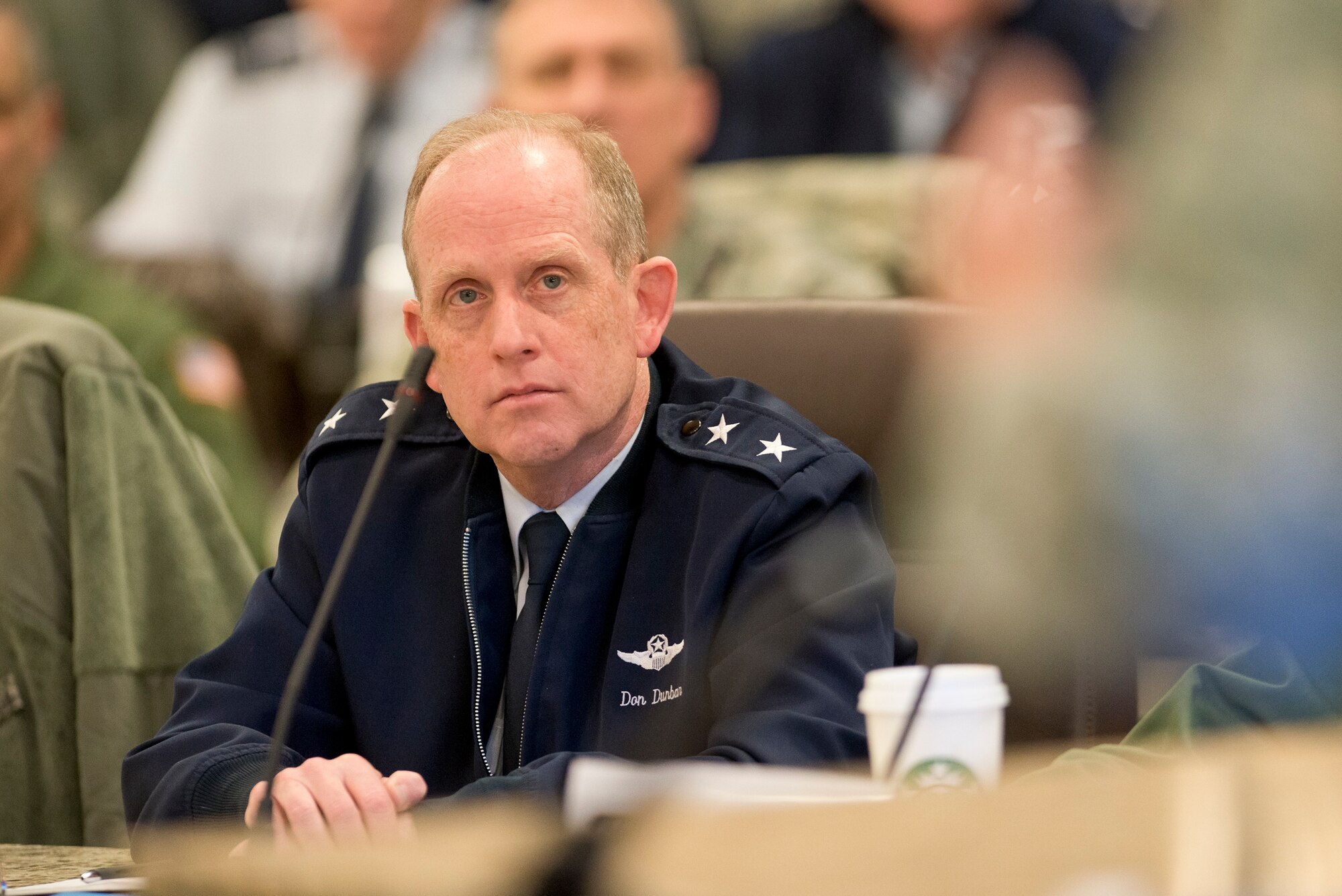 Maj. Gen. Donald P. Dunbar, Wisconsin adjutant general, listens as Lt. Gen. Stanley E. Clarke III, director of the Air National Guard, addresses senior ANG leaders during the ANG General Officer Summit at Joint Base Andrews, Md., Feb. 18, 2015. Topics for the two-day meeting included professionalism, ethics, Sexual Assault Prevention and Response, and leadership. (Air National Guard Photo by Master Sgt. Marvin R. Preston/Released)
