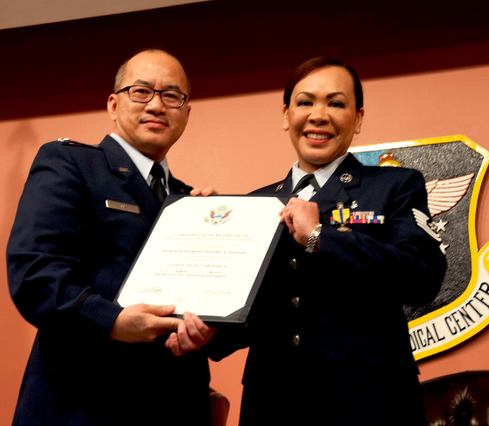 Tech. Sgt. Jennifer Parham retires from the Air Force Reserve during an official ceremony held on March 8, 2015 at Travis Air Force Base, Calif.Parham, assigned to the 349th Aerospace Medicine Squadron, retired after 21 years of faithful service to the United States Air Force. (U.S. Air Force photo/Staff Sgt. Amelia Leonard)