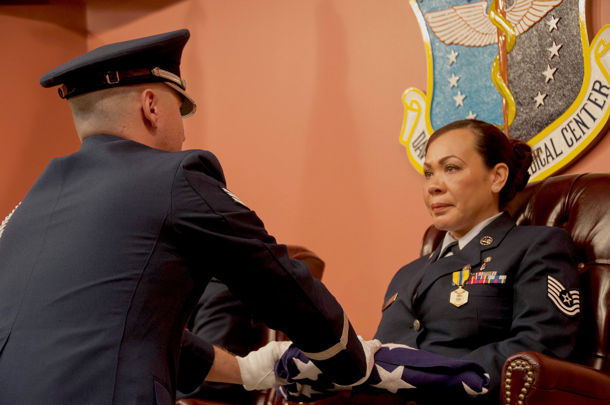 Tech. Sgt. Jennifer Parham retires from the Air Force Reserve during an official ceremony held on March 8, 2015 at Travis Air Force Base, Calif.Parham, assigned to the 349th Aerospace Medicine Squadron, retired after 21 years of faithful service to the United States Air Force. (U.S. Air Force photo/Staff Sgt. Amelia Leonard)
