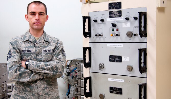 Tech. Sgt. Dan Sutton, 20th Air Force ICBM communications manager, poses in one of the missile communication maintenance section’s training room on F.E. Warren Air Force Base, Wyo., March 4, 2015. Sutton is working on standardizing all the training equipment used by the MCM sections in 20th AF to improve their effectiveness toward the mission. (U.S. Air Force photo by Airman 1st Class Malcolm Mayfield)