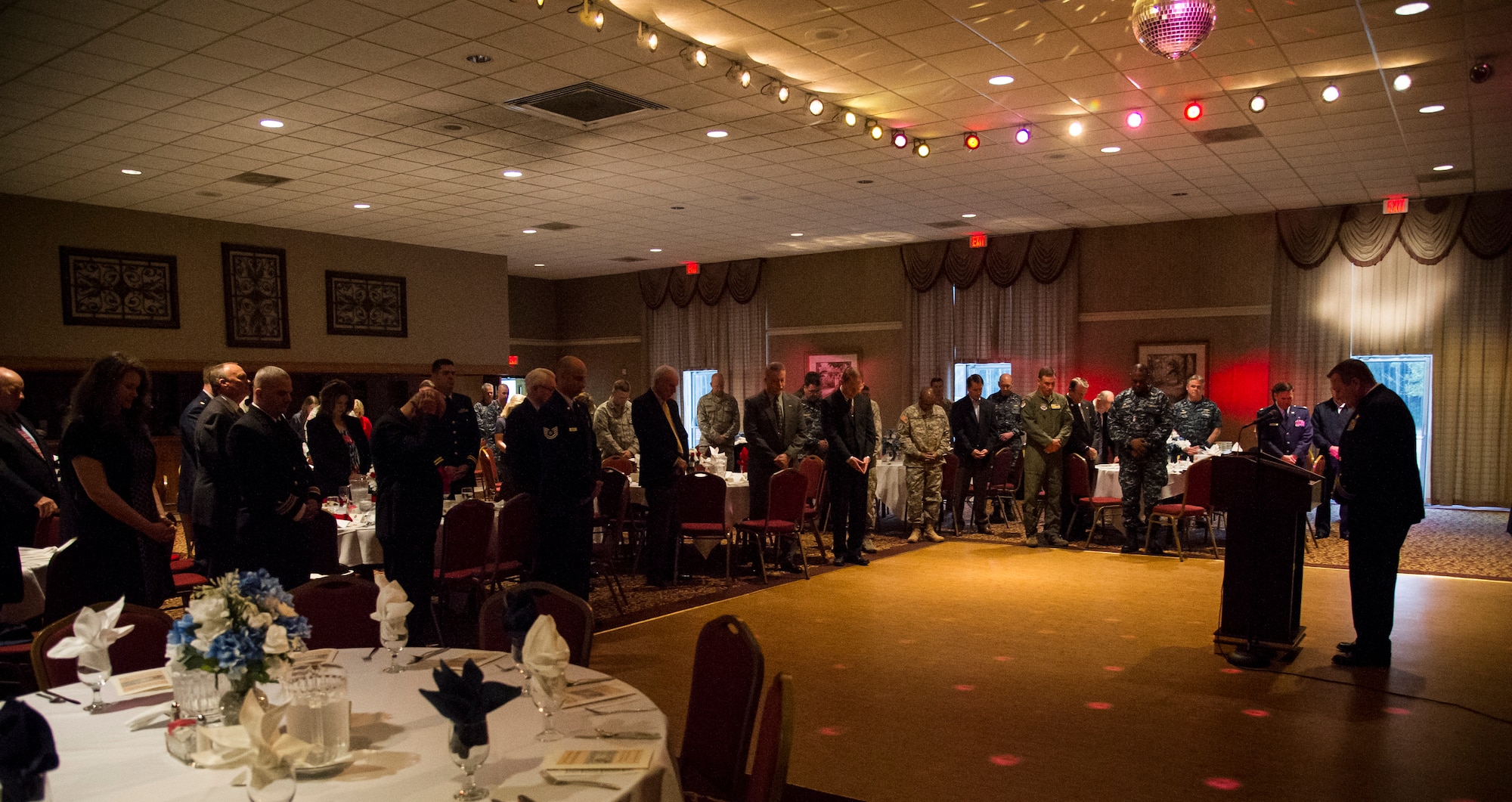 Navy Chaplain (Lt. Cmdr.) Russell Hale, 628th Air Base Wing Chapel, leads an invocation during the 2015 National Prayer Breakfast March 11, 2015, at the Red Bank Club on Joint Base Charleston – Weapons Station. During the prayer breakfast, there were scripture readings from the Jewish, Muslim and Christian religions. There were also prayers given to the Nation, Military, Department of Defense civilians and military families. (U.S. Air Force photo/Airman 1st Class Clayton Cupit)