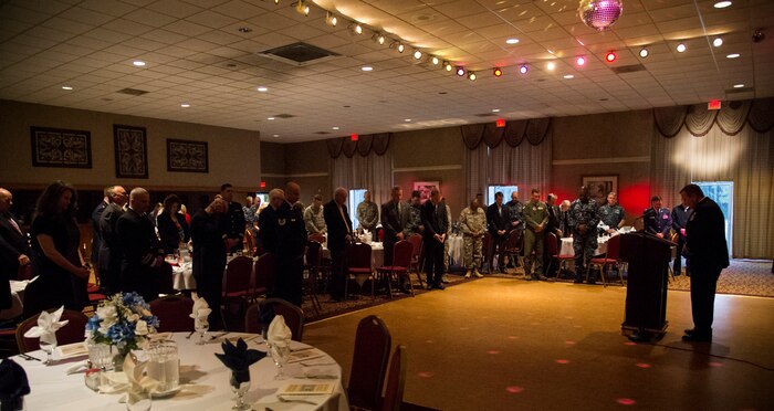 Navy Chaplain (Lt. Cmdr.) Russell Hale, 628th Air Base Wing Chapel, leads an invocation during the 2015 National Prayer Breakfast March 11, 2015, at the Red Bank Club on Joint Base Charleston – Weapons Station. During the prayer breakfast, there were scripture readings from the Jewish, Muslim and Christian religions. There were also prayers given to the Nation, Military, Department of Defense civilians and military families. (U.S. Air Force photo/Airman 1st Class Clayton Cupit)