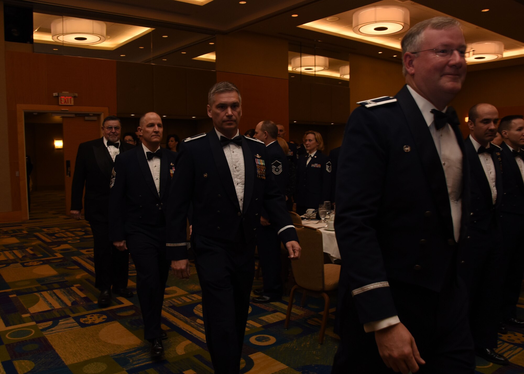 Col. Jeffrey A Van Dootingh, 911th Airlift Wing commander; Col. Douglas N. Strawbridge, 911 AW vice commander; Chief Master Sgt. Brian L. Zator, 911 AW command chief; and retired Capt. William A. Robinson enter as the official party at the 2015 Annual  Awards Banquet for the 911th Airlift Wing, March 7, 2015. Capt. Robinson, the guest speaker for the evening, is the longest held enlisted prisoner of war in U.S. history. (U.S. Air Force photo by Staff Sgt. Justyne Obeldobel)