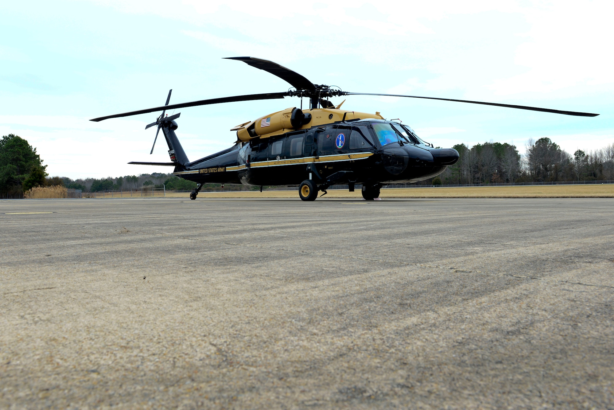 A VH-60 Blackhawk helicopter sits at Felker Army Airfield after taking its final flight from Fort Belvoir, Va., to Fort Eustis, Va., March 10, 2015. The helicopter began its life as an UH-60 Blackhawk before transforming into transportation for VIPs, and is set to become the newest addition to the U.S. Army Transportation Museum. (U.S. Air Force photo by Senior Airman Kimberly Nagle/Released)