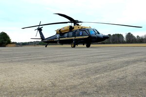 A VH-60 Blackhawk helicopter sits at Felker Army Airfield after taking its final flight from Fort Belvoir, Va., to Fort Eustis, Va., March 10, 2015. The helicopter began its life as an UH-60 Blackhawk before transforming into transportation for VIPs, and is set to become the newest addition to the U.S. Army Transportation Museum. (U.S. Air Force photo by Senior Airman Kimberly Nagle/Released)