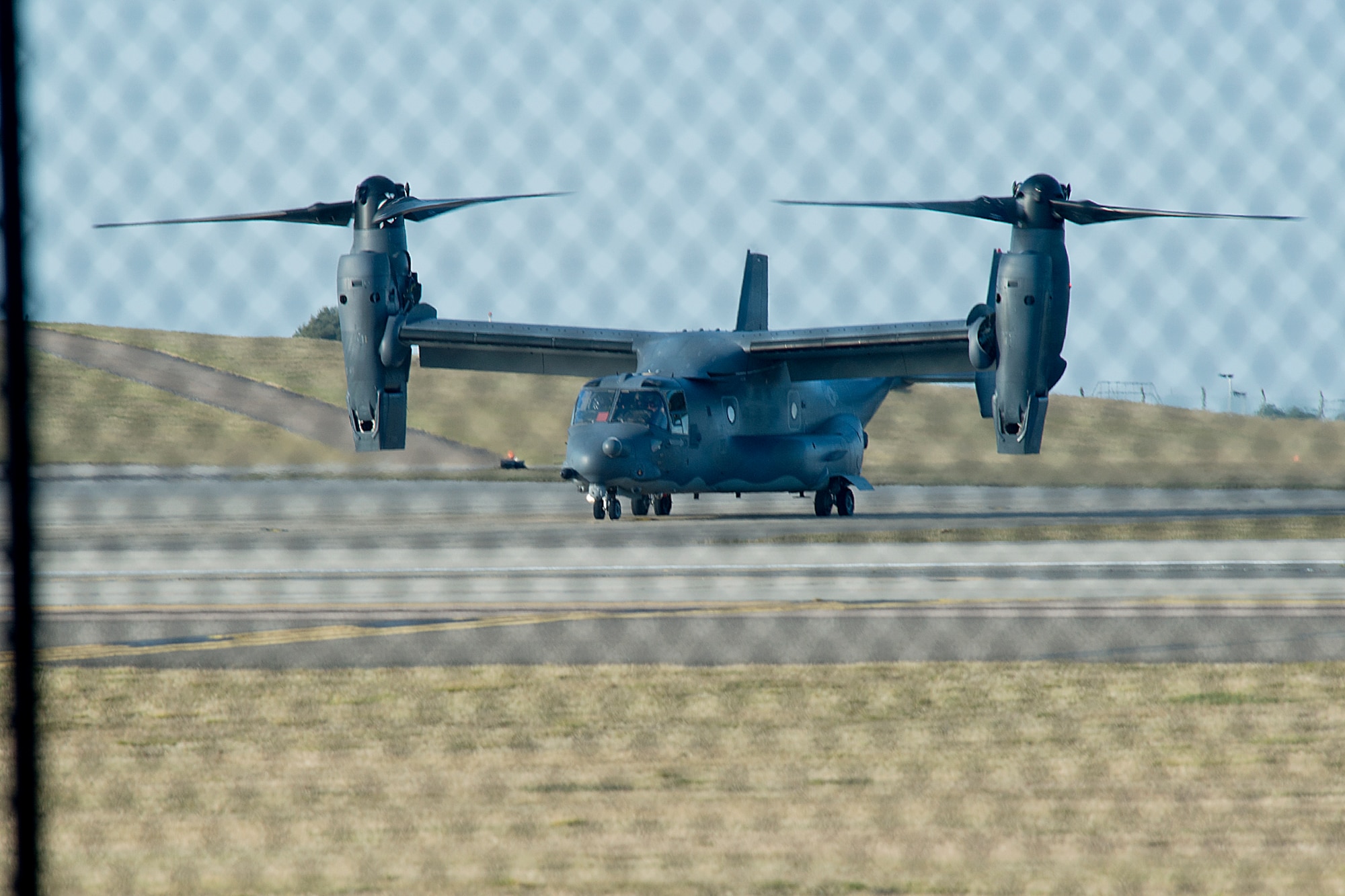 A CV-22B Osprey operated by the 7th Special Operations Squadron from Royal Air Force Mildenhall, England, prepares to take flight on the flightline at RAF Lakenheath, while enroute for a routine training mission March 11, 2015. The CV-22 is the U.S. Air Force's premier tiltrotor aircraft combining the vertical takeoff, hover and vertical landing qualities of a helicopter with the long-range, fuel efficiency and speed characteristics of a turboprop aircraft. (U.S. Air Force photo by Airman 1st Class Trevor T. McBride/Released)