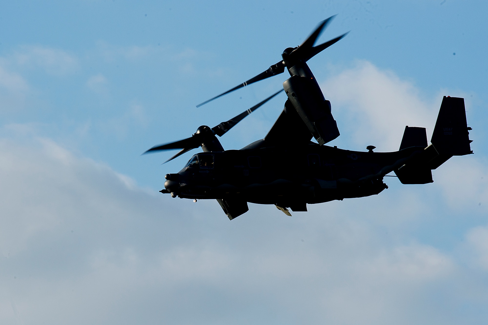 A CV-22B Osprey operated by the 7th Special Operations Squadron from Royal Air Force Mildenhall, England, flies over the flightline at RAF Lakenheath, while enroute for a routine training mission March 11, 2015. The CV-22 is the U.S. Air Force's premier tiltrotor aircraft combining the vertical takeoff, hover and vertical landing qualities of a helicopter with the long-range, fuel efficiency and speed characteristics of a turboprop aircraft. (U.S. Air Force photo by Airman 1st Class Trevor T. McBride/Released)