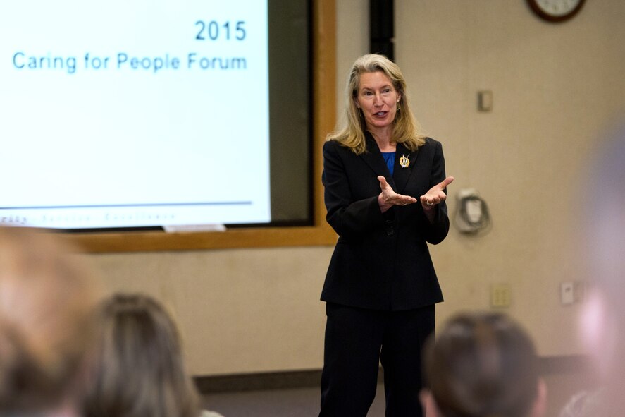 Retired U.S. Air Force Brig. Gen. Dana H. Born addresses attendees during a Caring for People forum at the Hanscom Conference Center, March 11. The forum brought military members, spouses and civilian employees together to discuss strategies that will strengthen base family support services and improve the quality of life for members of the community and their families. (U.S. Air Force photo by Mark Herlihy)