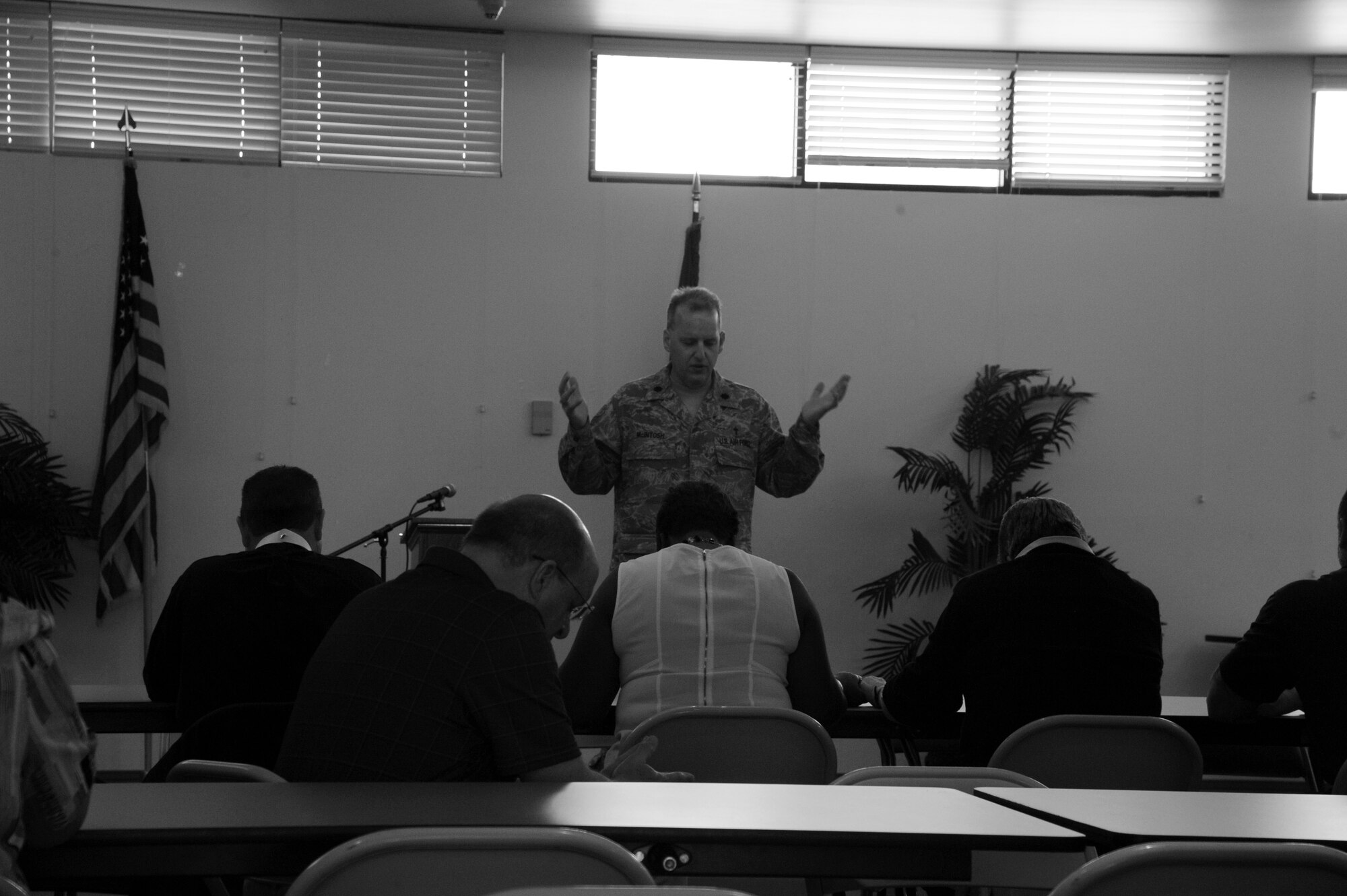 Chaplain (Lt. Col.) Andrew McIntosh, 6th Air Mobility Wing, leads the lunch blessing during a joint clergy day held March 9, MacDill Air Force Base, Fla. While here, the religious influencers spent their day learning about the spiritual needs of the members of the U.S. Military. (U.S. Air Force photo/Tech. Sgt. Peter Dean)