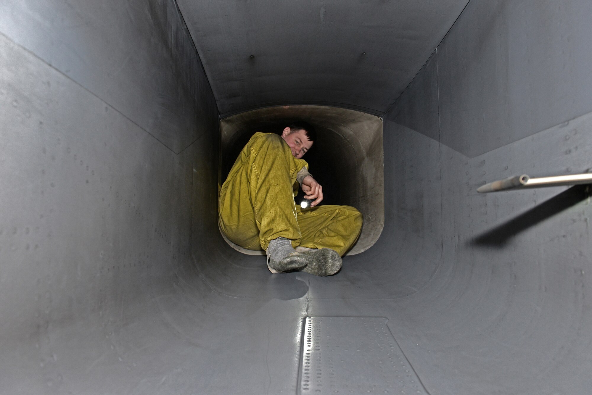 Staff Sgt. Andrew McNeal, 492nd Aircraft Maintenance Unit dedicated crew chief, inspects the fan blades of an air intake for damage after an F-15E Strike Eagle flight at Royal Air Force Lakenheath, England, March 5, 2015. The 48th Fighter Wing not only exceeded the wing’s flying goal, but also beat the Air Force standard, flying 594 F-15E Strike Eagle training flights or sorties for the month of February.  (U.S. Air Force photo by Airman 1st Class Erin R. Babis/Released) 