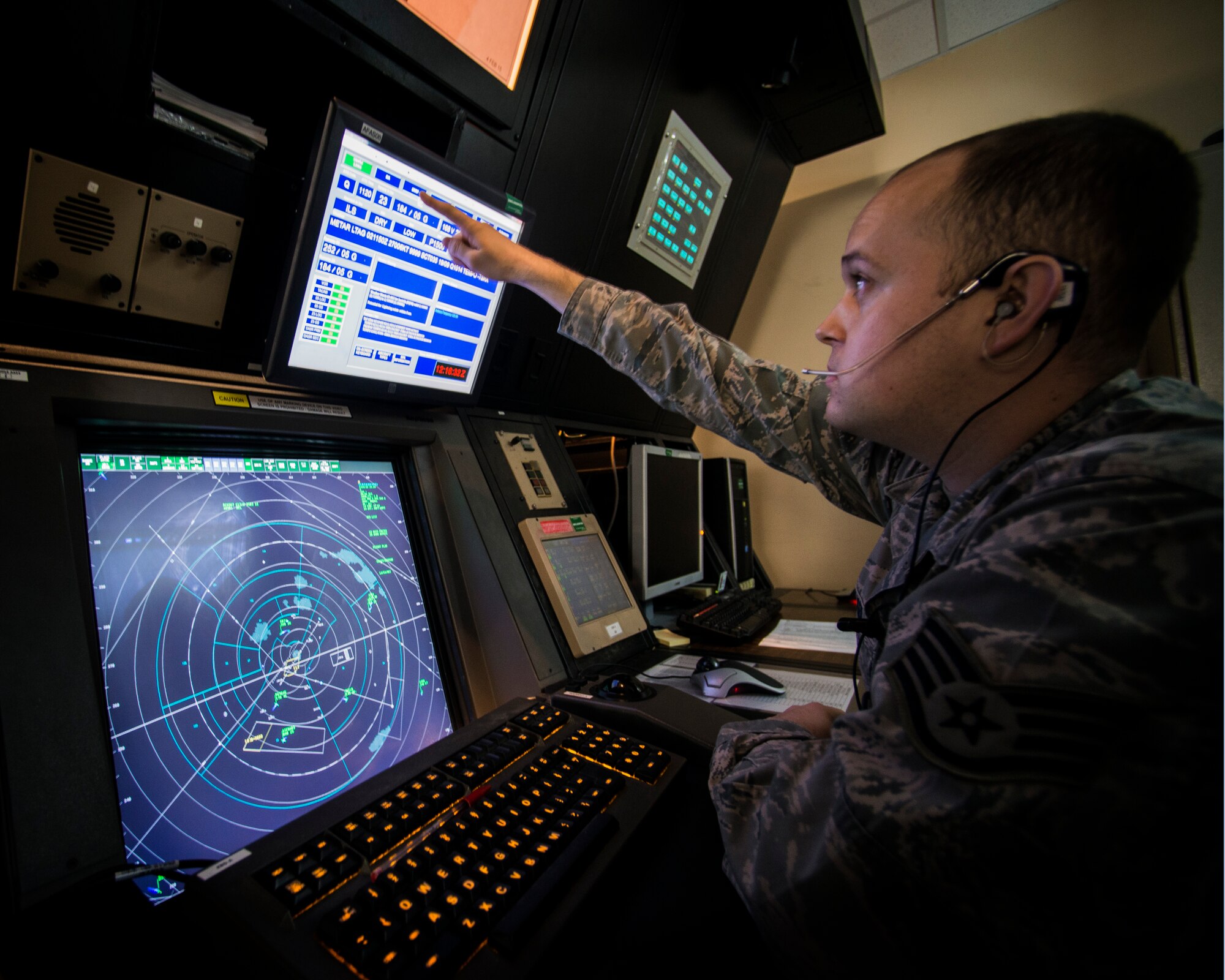 Staff Sgt. Johnathan Walker, 39th Operations Support Squadron air traffic controller, validates weather information with the Ankara Control Center for the release of an aircraft March 2, 2015, at Incirlik Air Base, Turkey. Validating weather is essential to ensuring safety for every flight in and out of Incirlik AB. (U.S. Air Force photo by Airman Cory W. Bush/Released)