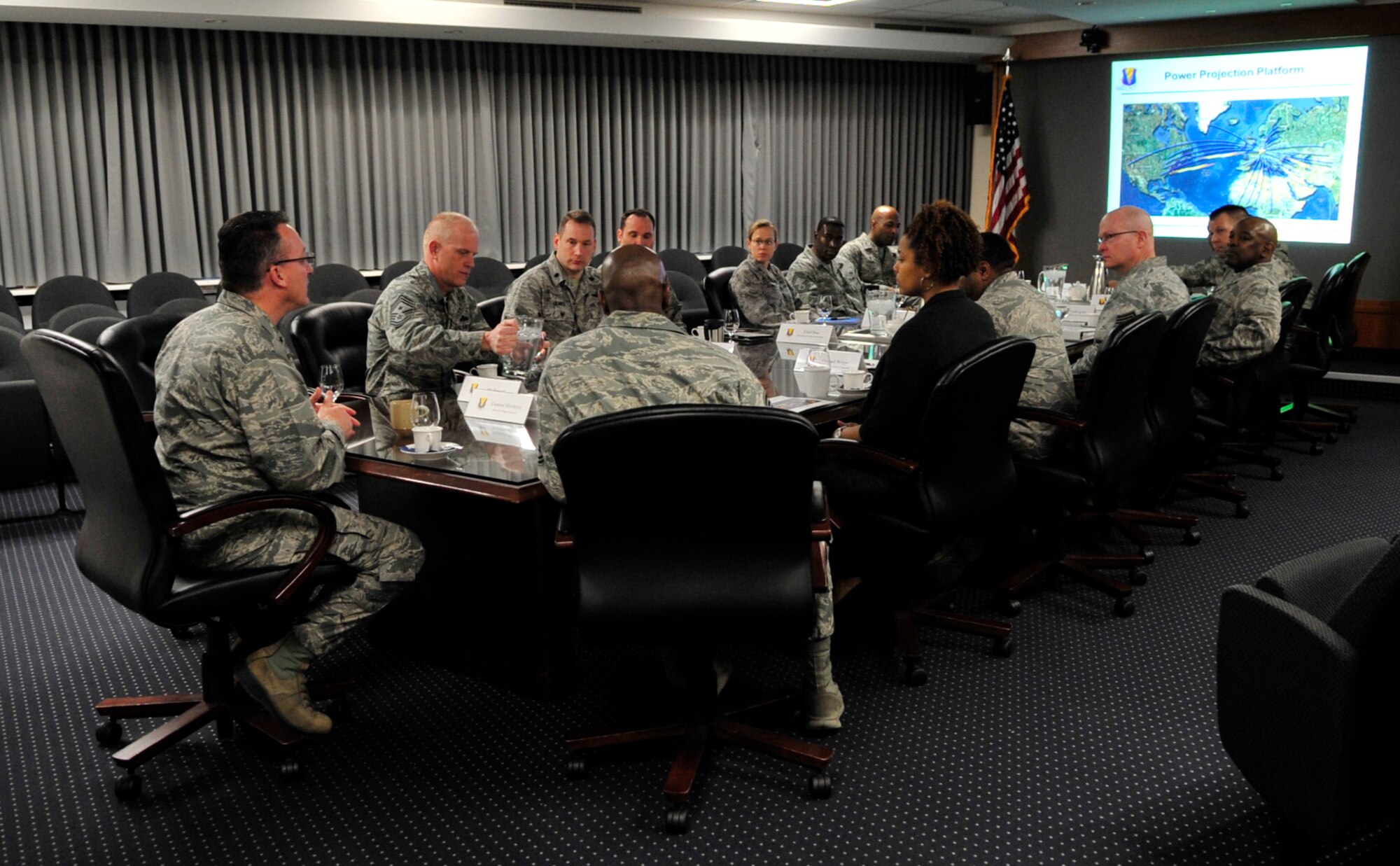 Ramstein leaders give a mission brief to Chief Master Sgt. Kaleth Wright, 3rd Air Force command chief master sergeant, to demonstrate the capabilities of the units assigned to the 86th Airlift Wing, March 2, 2015, at Ramstein Air Base, Germany. The brief was part of Wright’s initial immersion as the new numbered Air Force command chief. (U.S. Air Force photo/Airman 1st Class Larissa Greatwood)