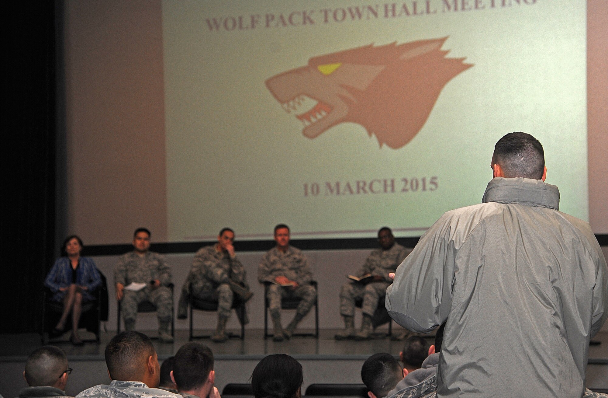 An 8th Fighter Wing Airman asks a question to base leadership during the Wolf Pack town hall meeting at Kunsan Air Base, Republic of Korea, Mar. 10, 2015. An eight-member panel of 8th FW leadership held three town hall sessions throughout the day for Airmen to meet and discuss their concerns regarding base support issues. (U.S. Air Force photo by Senior Airman Divine Cox/Released)
