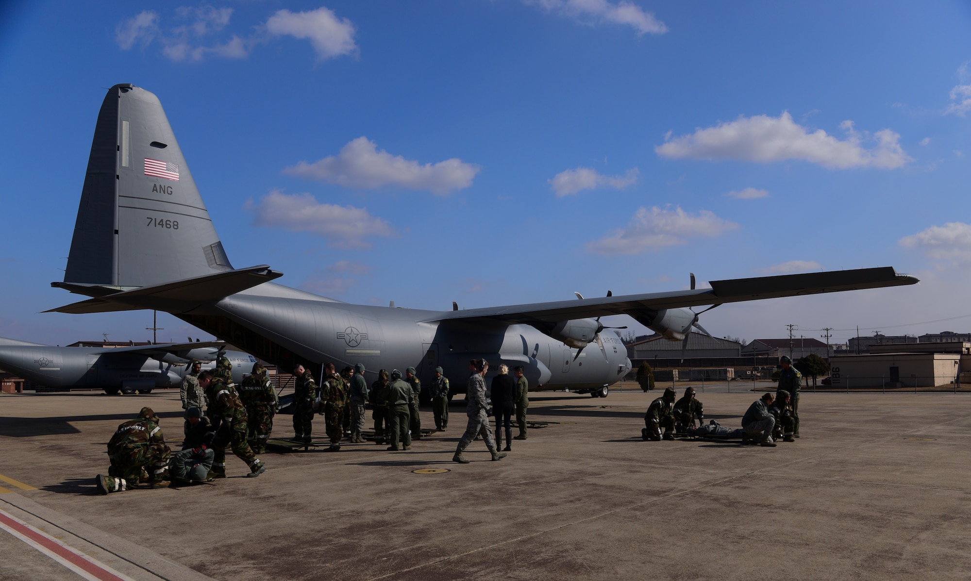 51st Medical Group Airmen receive training on carrying litters during a medical evacuation airlift training scenario March 4, 2015, at Osan Air Base, Republic of Korea. Medical evacuations are a timely and efficient movement and en route care provided by medical personnel to evacuate wounded personnel. (U.S. Air Force photo by Senior Airman David Owsianka)