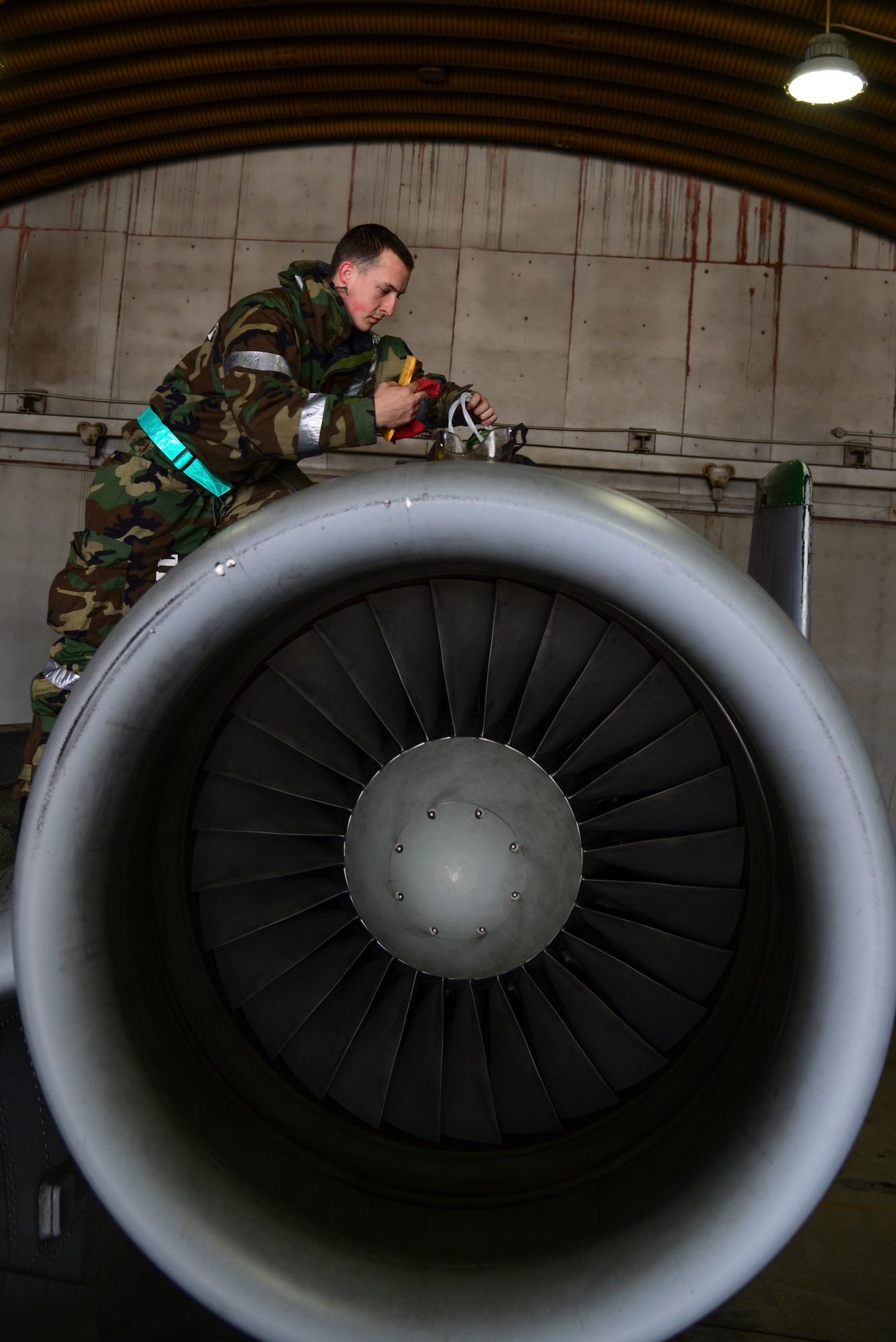 Staff Sgt. Justin Swearingen, 51st Aircraft Maintenance Squadron A-10 Thunderbolt II crew chief, collets an oil sample during operational readiness exercise Beverly Midnight 15-1 March 3, 2015, at Osan Air Base, Republic of Korea. The oil is checked every 10 hours to insure that it is free of metal. (U.S. Air Force photo by Senior Airman Matthew Lancaster)