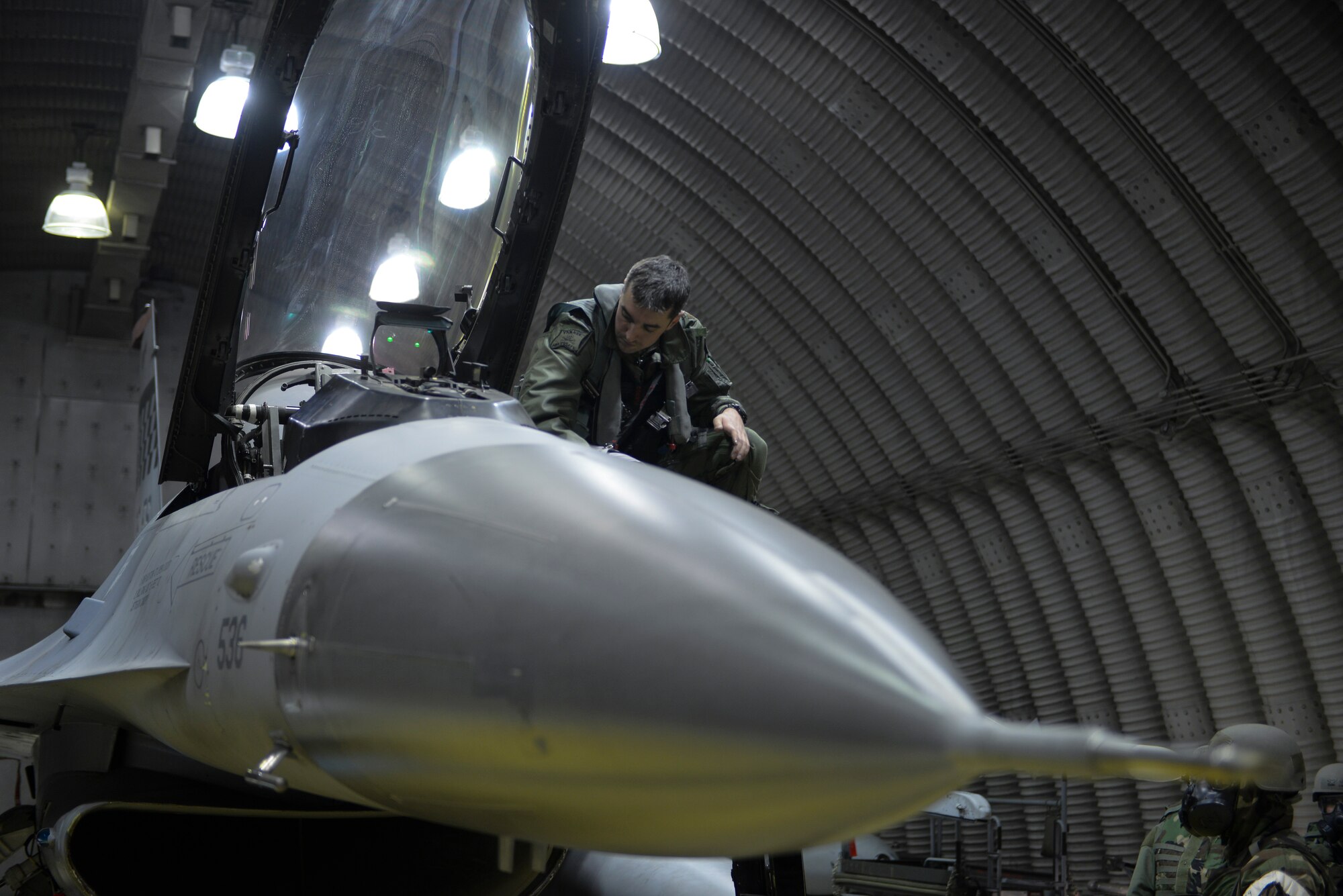 Maj. Jason Miller, 36th Fighter Squadron pilot, performs a pre-flight check during the Operational Readiness Exercise Beverly Midnight Exercise 15-01 March 2, 2015, at Osan Air Base, Republic of Korea. This exercise is designed to test American forces in the ROK on their mission readiness in the event of an emergency or wartime environment. (U.S. Air Force photo by Senior Airman David Owsianka)
