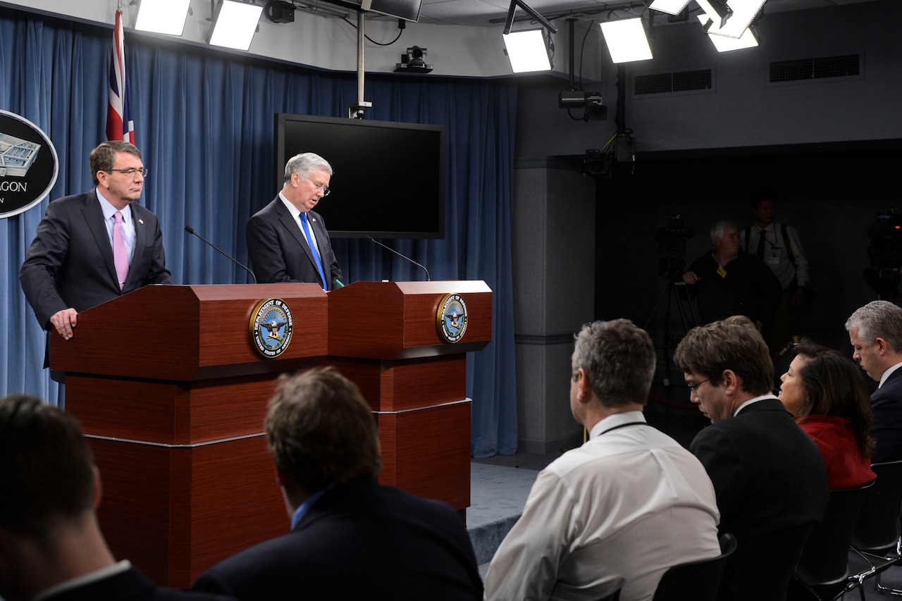 U.S. Defense Secretary Ash Carter and British Defense Secretary Michael C. Fallon brief reporters during a joint news conference at the Pentagon, March 11, 2015. The leaders met beforehand to discuss security and other matters of mutual importance. DoD photo by Petty Officer 2nd Class Sean Hurt