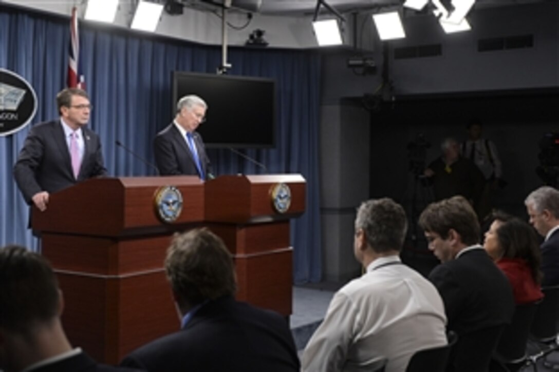 U.S. Defense Secretary Ash Carter and British Defense Secretary Michael Fallon brief reporters during a joint news conference at the Pentagon, March 11, 2015. The leaders met beforehand to discuss security and other matters of mutual importance.