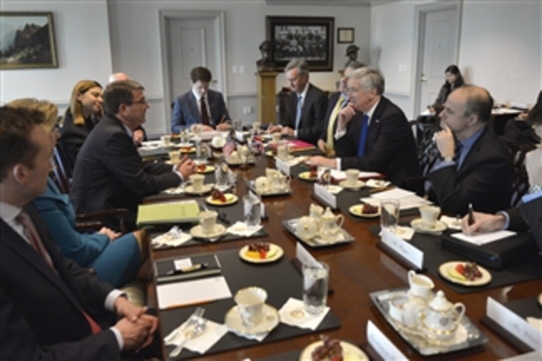 U.S. Defense Secretary Ash Carter, third left, and British Defense Secretary Michael Fallon, third right, meet at the Pentagon, March 11, 2015. Both leaders discussed defense matters including coalition efforts to defeat ISIL. 