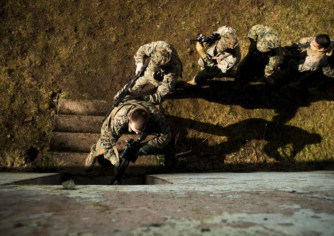 U.S. Marines with Special-Purpose Marine Air-Ground Task Force Crisis Response-Africa move into a house while conducting close-quarters battle drills with U.S. Army Special Forces in Baumholder, Germany, March 4, 2015. Special Forces personnel taught the Marines a variety of different techniques they use to clear buildings in urban environments. (U.S. Marine Corps photo by Sgt. Paul Peterson/Released)