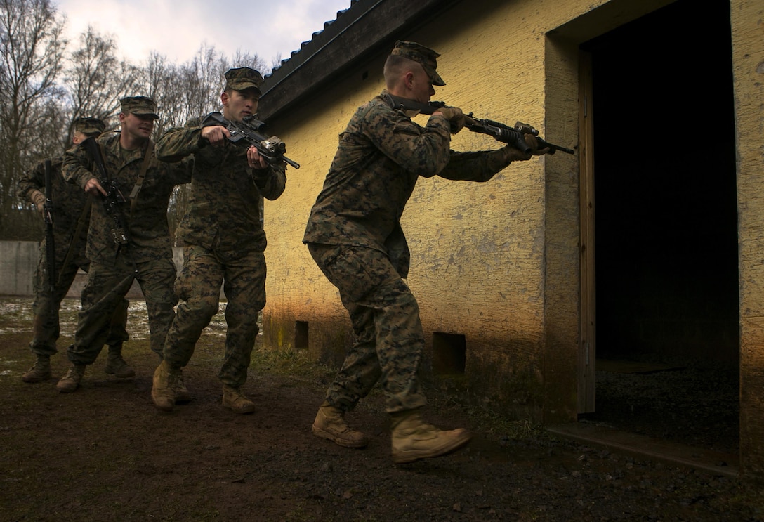 U.S. Marines with Special-Purpose Marine Air-Ground Task Force Crisis Response-Africa move into a house while conducting close quarters battle drills with U.S. Army Special Forces in Baumholder, Germany, March 4, 2015. Special Forces personnel worked with the Marines to hone their ability to clear buildings, preparing the two groups for future operations together. (U.S. Marine Corps photo by Sgt. Paul Peterson/Released)