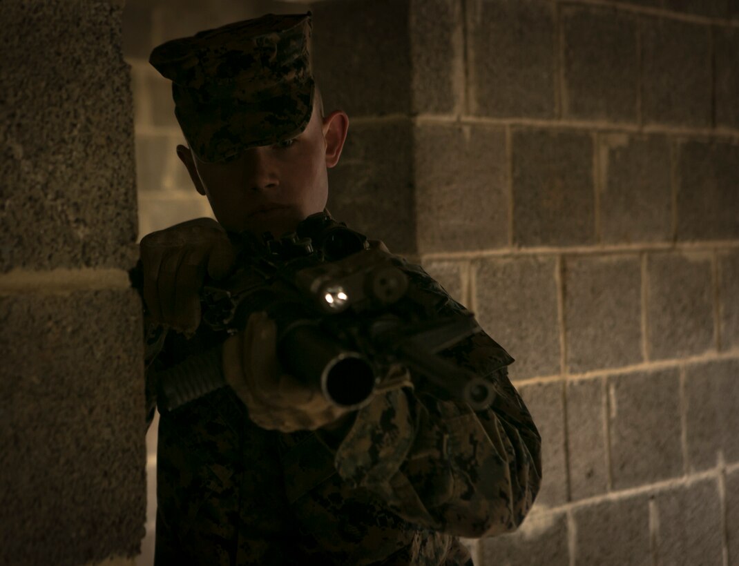 U.S. Marine Lance Cpl. Steven Watson, a Marine with Special-Purpose Marine Air-Ground Task Force Crisis Response-Africa, clears a room in a training facility while conducting close-quarters battle drills with U.S. Army Special Forces in Baumholder, Germany, March 4, 2015. The Marines moved from room to room as a team, honing their ability to rapidly secure buildings in an urban environment. (U.S. Marine Corps photo by Sgt. Paul Peterson/Released)