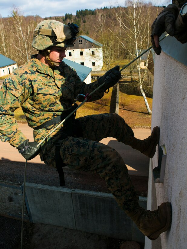 U.S. Marine Lance Cpl. Trevor Grames, with Special-Purpose Marine Air-Ground Task Force Crisis Response-Africa, rappels down a building during a training exercise with U.S. Army Special Forces in Baumholder, Germany, March 6, 2015. The training prepared the Marines to use various rappelling techniques to maneuver down the sides of structures. (U.S. Marine Corps photo by Sgt. Paul Peterson/Released)