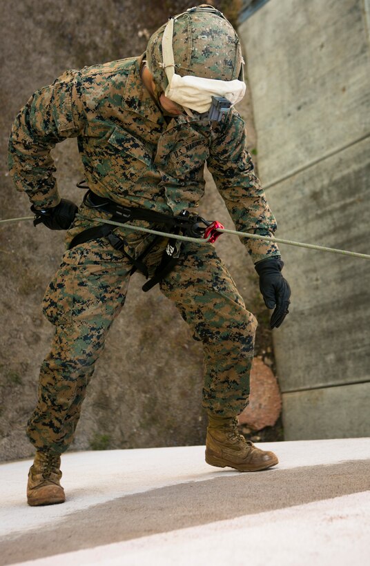 U.S. Marine Cpl. Steven Carter, with Special-Purpose Marine Air-Ground Task Force Crisis Response-Africa, rappels down a building during a training exercise with U.S. Army Special Forces in Baumholder, Germany, March 6, 2015. The ability to rappel down the side of structures allows service members to rapidly move in built-up urban environment. (U.S. Marine Corps photo by Sgt. Paul Peterson/Released)