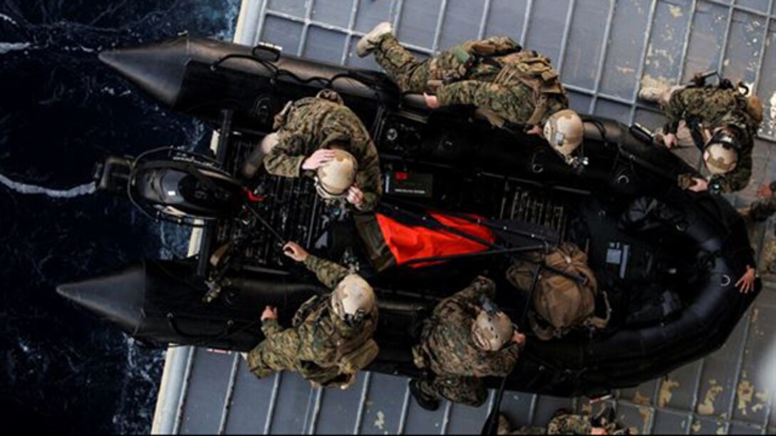 U.S. Marines with the 15th Marine Expeditionary Unit’s Maritime Raid Force prepare to depart USS Essex (LHD 2) on a combat rubber raiding craft during Amphibious Squadron Three/Marine Expeditionary Unit Integration Training (PMINT) off the coast of San Diego March 4, 2015. The MRF used CRRCs during a precision raid exercise in preparation for their deployment later this spring. 