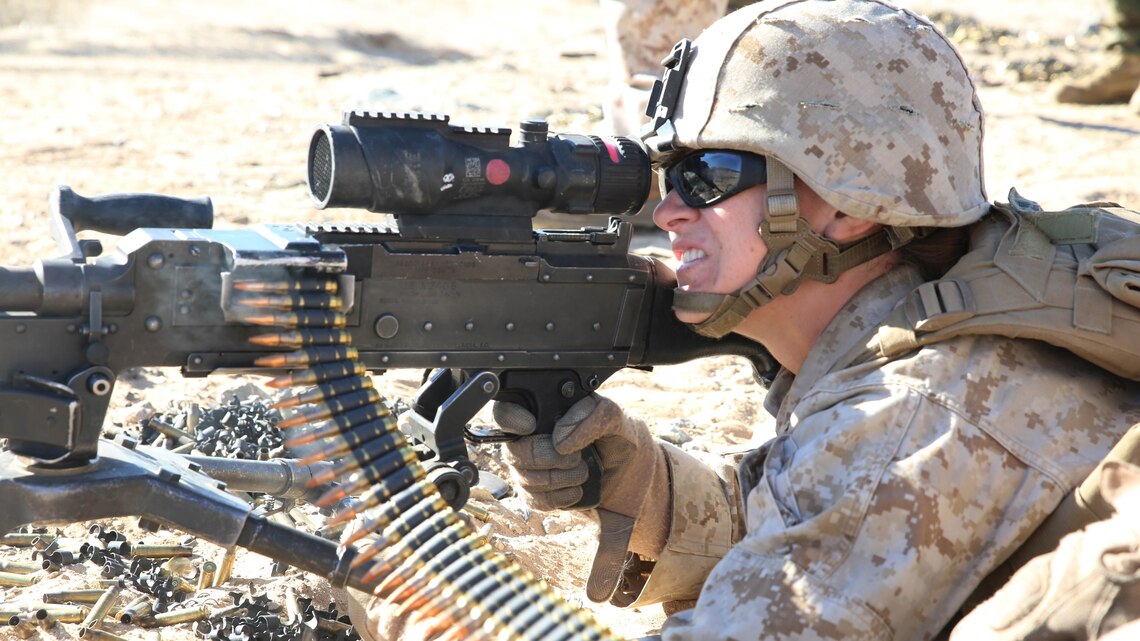 Sgt. Hannah S. Jacobson, machine gunner with Weapons Company, Ground Combat Element Integrated Task Force, provides close supporting fires for their squad while engaging targets with the M240B Medium Machine Gun during a Marine Corps Operational Test and Evaluation Activity assessment at Range 107, Marine Corps Air Ground Combat Center Twentynine Palms, March 10, 2015. From October 2014 to July 2015, the GCEITF will conduct individual and collective level skills training in designated ground combat arms occupational specialties in order to facilitate the standards-based assessment of the physical performance of Marines in a simulated operating environment performing specific ground combat arms tasks. 