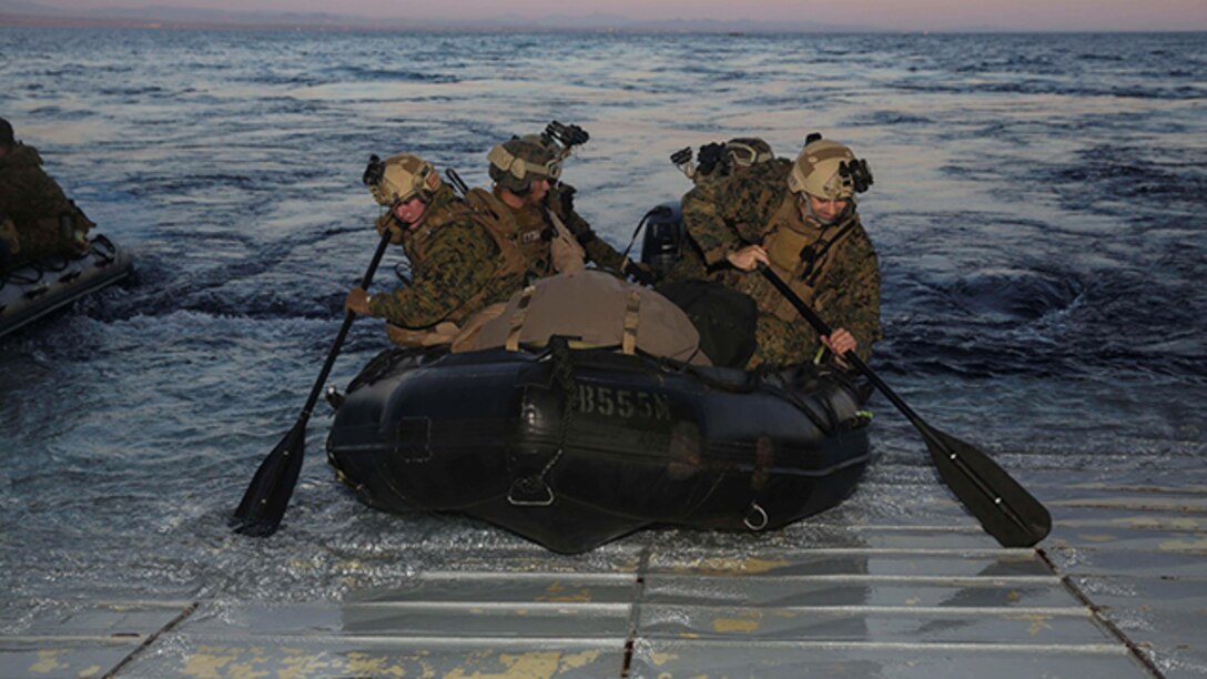 U.S. Marines with the 15th Marine Expeditionary Unit’s Maritime Raid Force disembark the USS Essex during Amphibious Squadron/Marine Expeditionary Unit Integration Training off the coast of San Diego March 4, 2015. These Marines rode combat rubber raiding craft to a beach aboard Camp Pendleton, Calif., to execute a precision raid. 