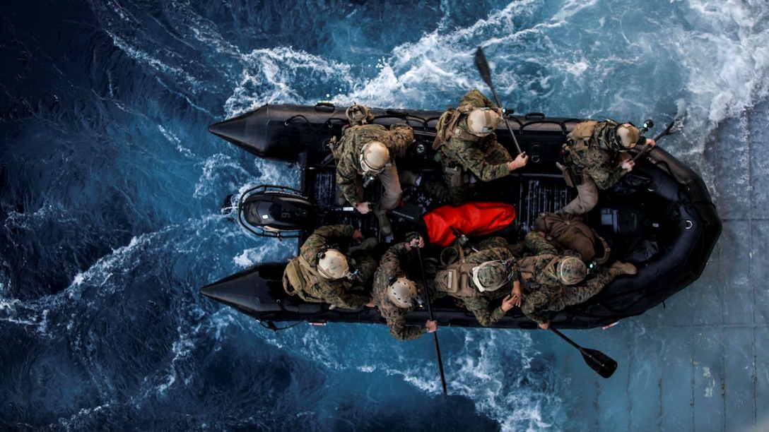 U.S. Marines with the 15th Marine Expeditionary Unit’s Maritime Raid Force depart the USS Essex on a combat rubber raiding craft during Amphibious Squadron Three/Marine Expeditionary Unit Integration Training off the coast of San Diego March 4, 2015. The MRF used CRRCs during a precision raid exercise in preparation for their deployment later this spring.